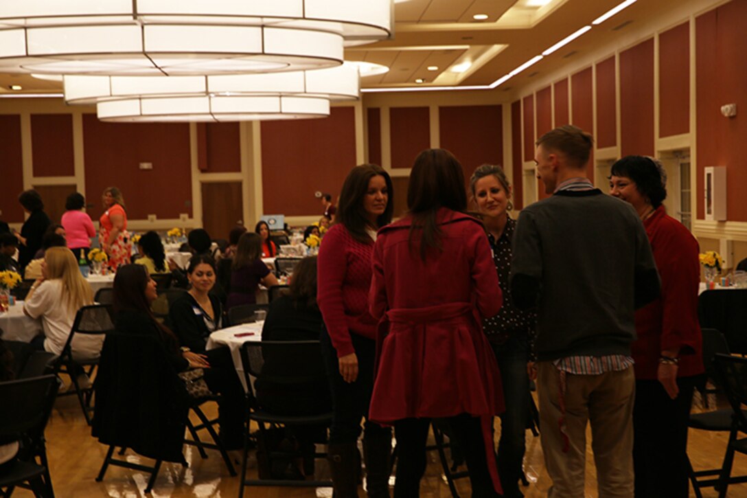 Service members with the 2nd Marine Logistics Group and their spouses get to know one another better at Marston Pavilion aboard Camp Lejeune, N.C., Feb. 25, 2014. The event informed spouses of resources available to them while their loved ones are deployed and gave them the chance to meet other spouses within the MLG. (U.S. Marine Corps photo by Lance Cpl. Shawn Valosin)