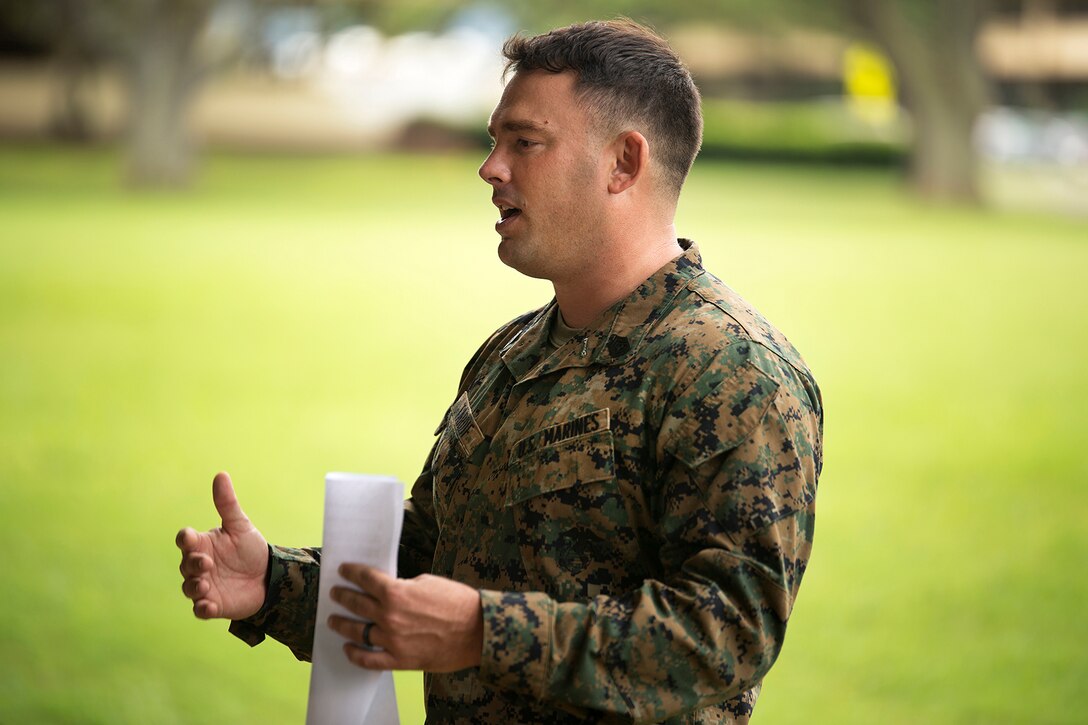 Gunnery Sgt. Timothy C. Tardif, staff noncommissioned officer of Scout Sniper School, School of Infantry West-Detachment Hawaii, and a 32-year-old native of Denver, speaks to Marines of Corporals Course at Dewey Square on Marine Corps Base Hawaii, Feb. 25, 2013. The Marines had just completed a four hour-long case study, or training exercise, based off of true experiences Tardif faced as a corporal in combat during Operation Iraqi Freedom, April 12, 2003. Tardif received shrapnel wounds while assaulting the enemy compound and refused medical attention in order to keep fighting alongside his platoon. Thirteen months later he was awarded the Silver Star for the actions he displayed on that day. Tardif explained to the Marines the Marine Corps is what they make of it, and the effectiveness of their leadership will depend of the bond they build with their Marines. (U.S. Marine Corps photo by Lance Cpl. Matthew Bragg)