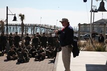 Marines and sailors with General Support Maintenance Company, 2nd Maintenance Battalion, 2nd Marine Logistics Group listen intently as they get a history lesson from John Moseley, the special events coordinator with the Fort Fisher State Historic Site outside of Carolina Beach, N.C., Feb. 27, 2014. The hike was used to educate Marines and sailors about their past and to uphold operational proficiency. (U.S. Marine Corps photo by Lance Cpl. Shawn Valosin)