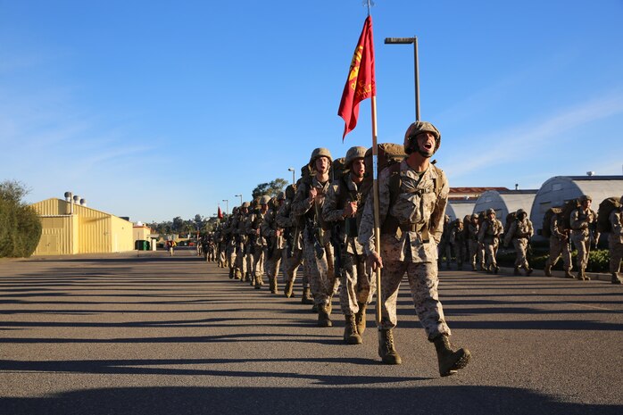 Recruits of Company E, 2nd Recruit Training Battalion, sing cadence during a 5.7 mile sustainment hike around the depot Feb. 15, carrying a combat load in their backpacks. 