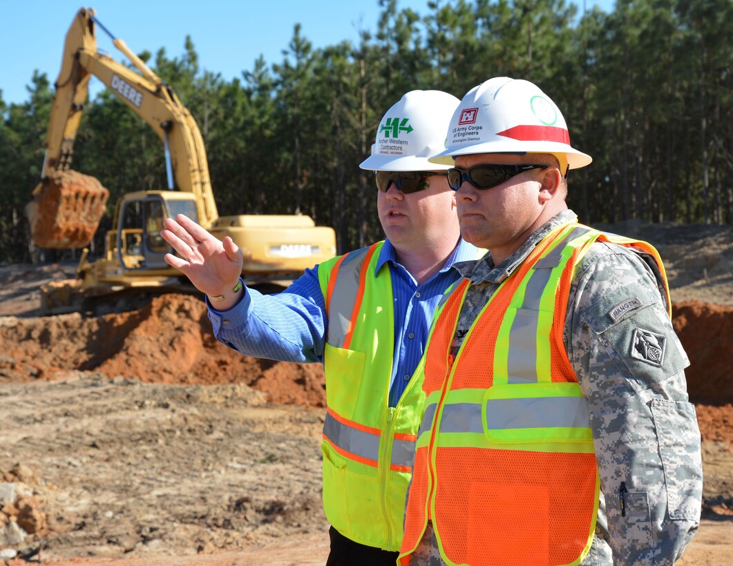 Quality Assurance contractor Michael Neuman (left) discusses areas of the future 3rd Special Forces Group operations facility with Wilmington District Commander Col. Steven Baker during the start of construction. The state-of-the-art facility will consolidate the group in one location instead of being scattered throughout Fort Bragg.  