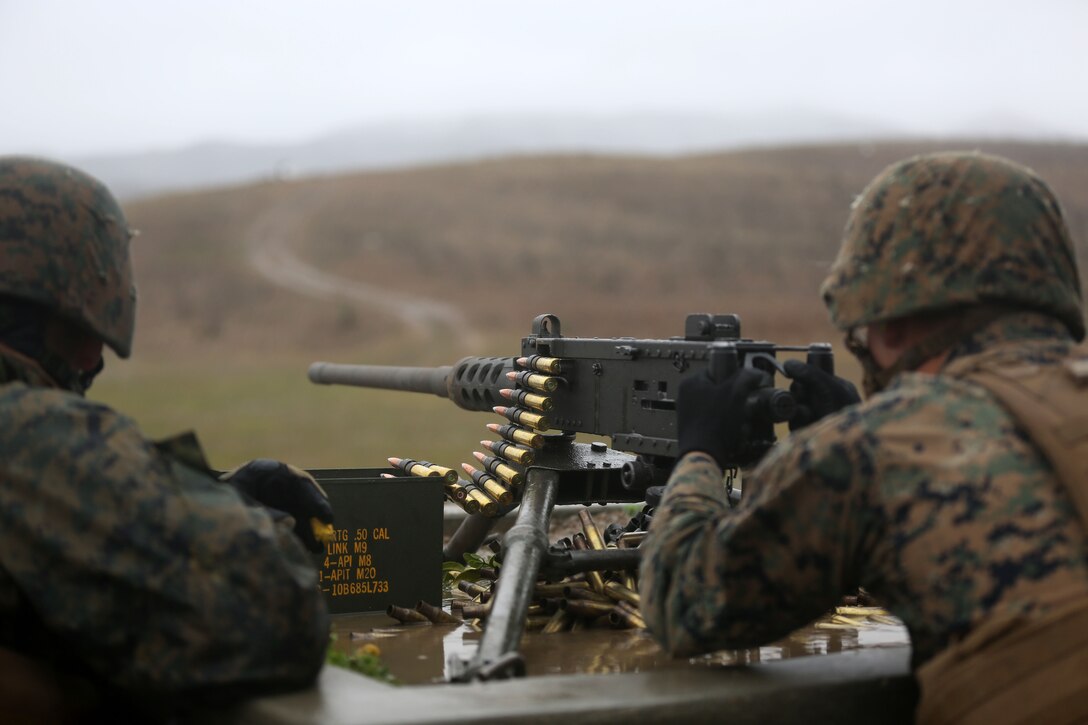 A Marine with Combat Logistics Battalion 11, the logistics combat element of the 11th Marine Expeditionary Unit, engages multiple moving targets with an M2 .50 caliber machine gun during a crew-served weapons training event here Feb. 28. The Marines also employed the M240G medium machine gun during the same training cycle. During their upcoming deployment this summer with the 11th MEU, CLB-11 Marines will need to be proficient in motorized weapon employment during convoys and patrols.
