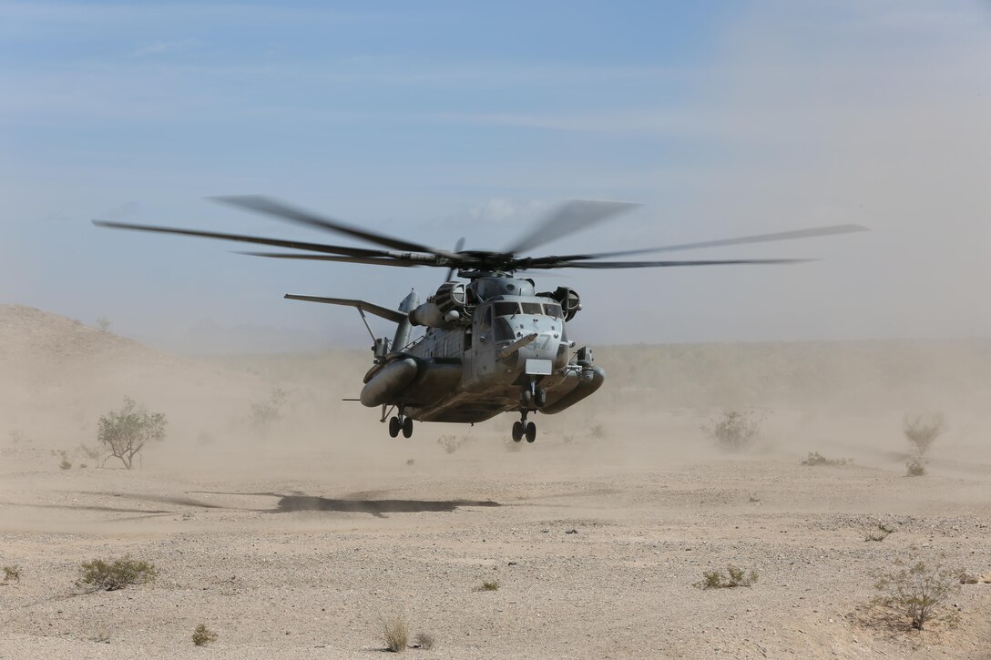 A CH-53E Super Stallion lands in Yuma, Ariz. with Marines and Sailors for a live-fire field trip Feb. 27. Marine Heavy Helicopter Squadron 465 worked alongside Marine Fighter Attack Training Squadron 101 by assisting them with the transportation of the participants. 