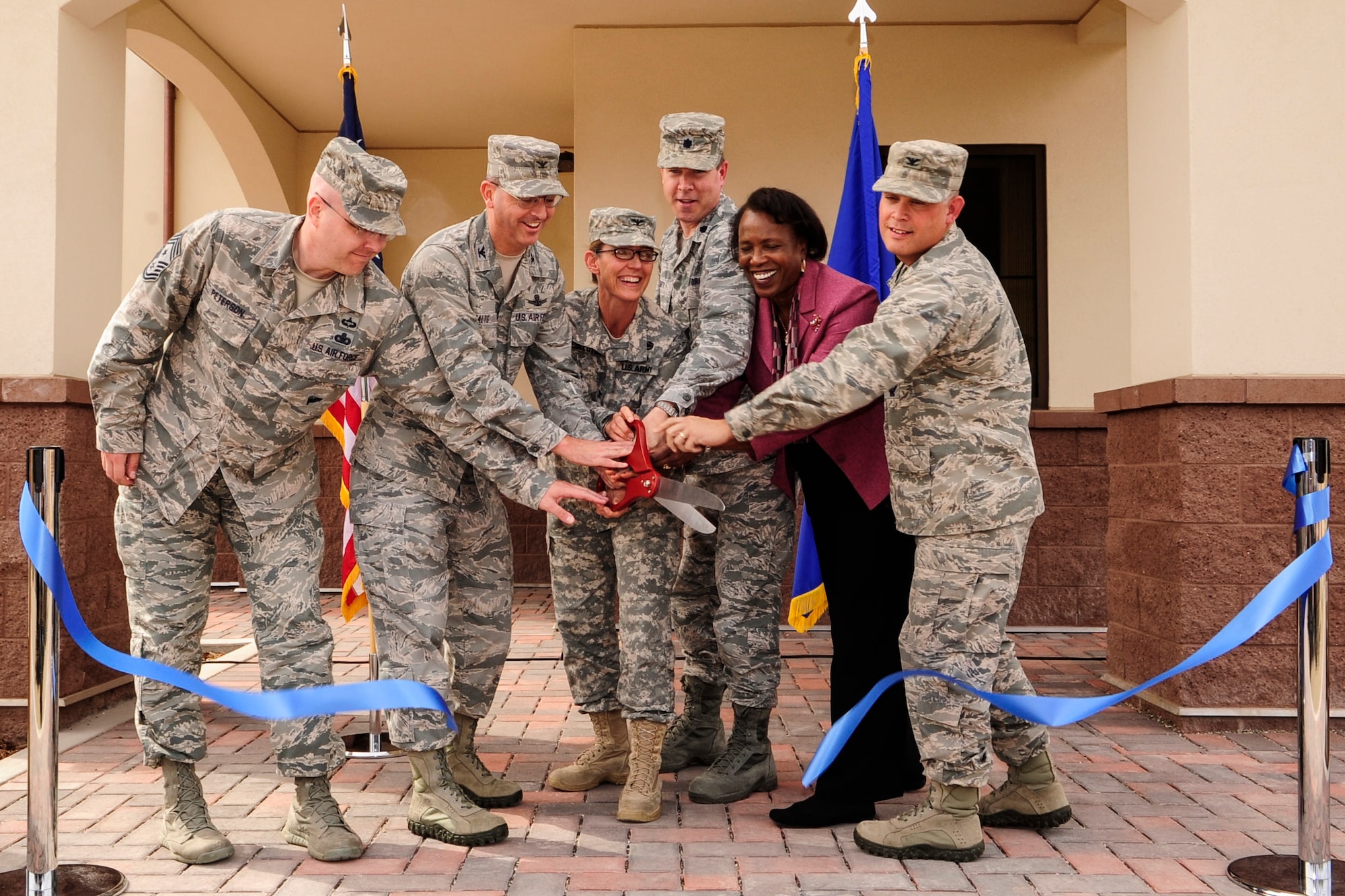 VANDENBERG AIR FORCE BASE, Calif. – Military leaders cut a ceremonial ribbon signifying the opening of the new education center, here Feb. 27. This new facility replaces a 60 year-old elementary school campus built in 1959 which had served as the bases education center. (U.S. Air Force photo/ Airman 1st Class Yvonne Morales)

