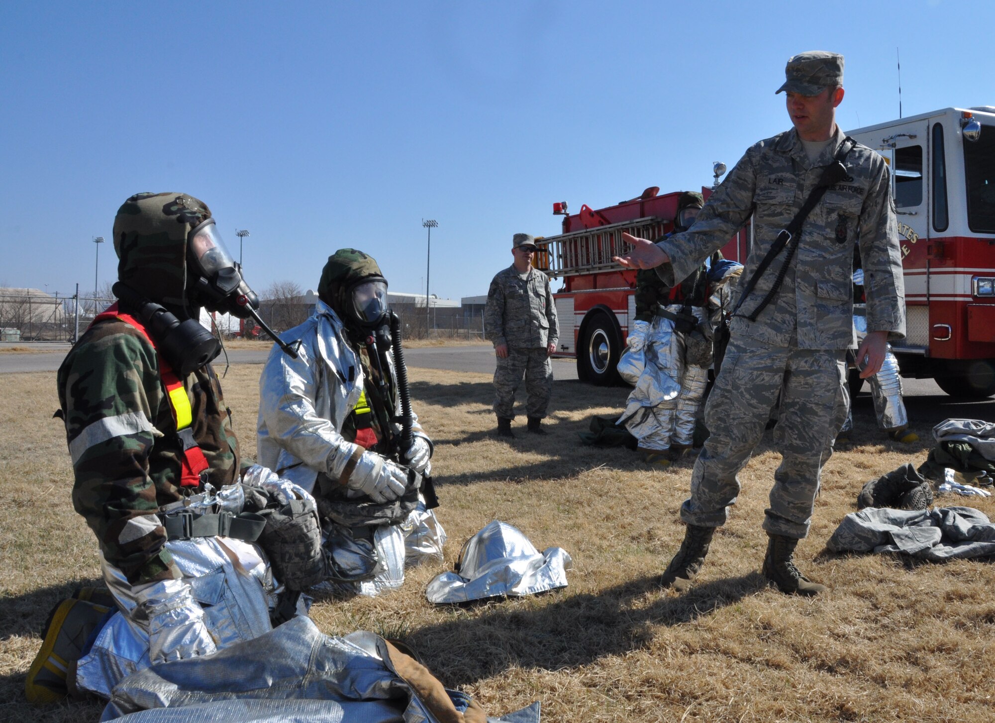 Tech. Sgt. Scott Lair provides instruction to members of the 507th Civil Engineer Squadron on the Joint Firefighter's Integrated Response Ensemble here during the March Unit Training Assembly. (U.S. Air Force Photo/Maj. Jon Quinlan)
