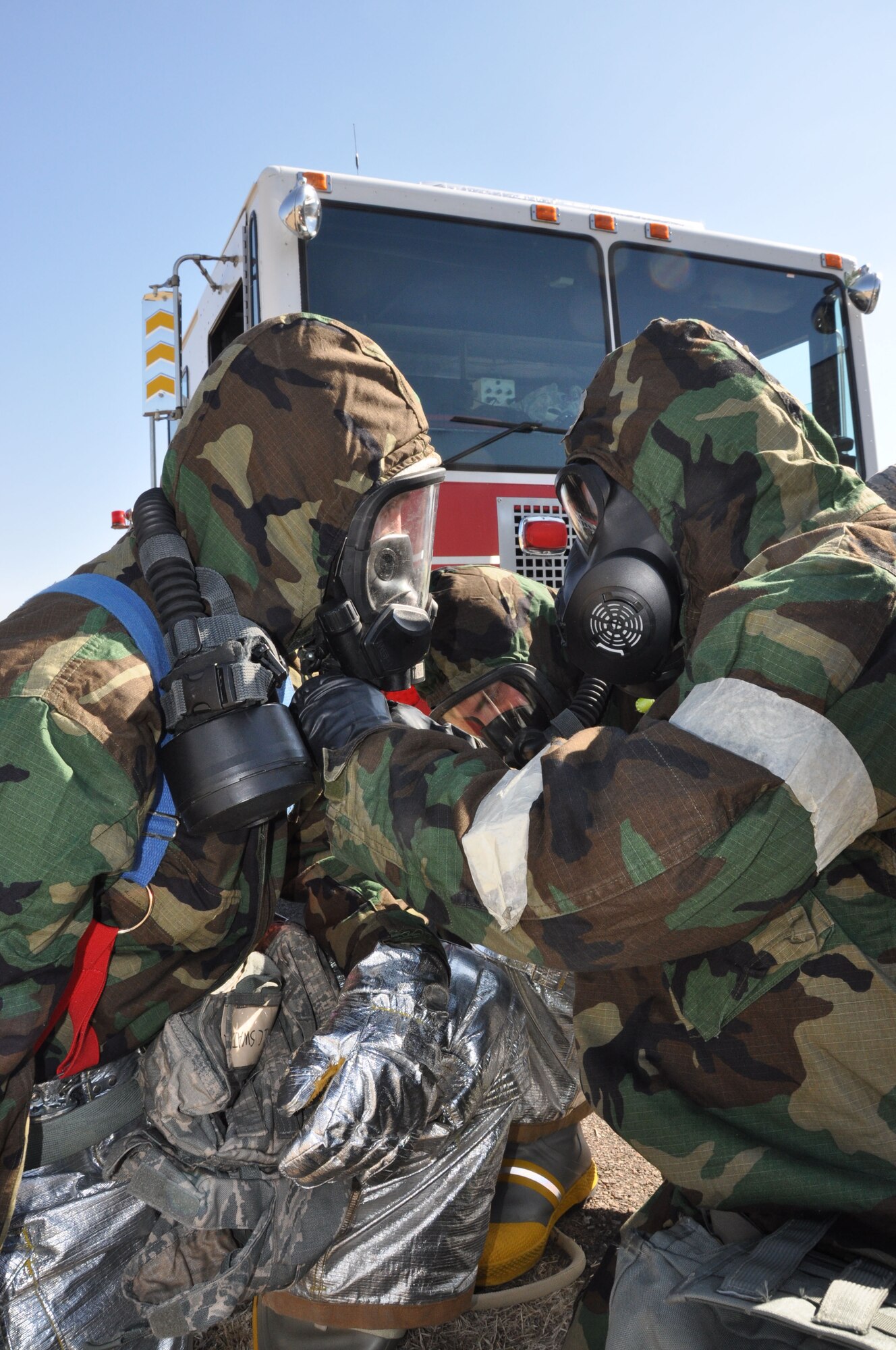 Reservists of the 507th Civil Engineer Squadron perform buddy checks while conducting readiness training with the Joint Firefighter's Integrated Response Ensemble (JFIRE) here during the March Unit Training Assembly. (U.S. Air Force Photo/Maj. Jon Quinlan)