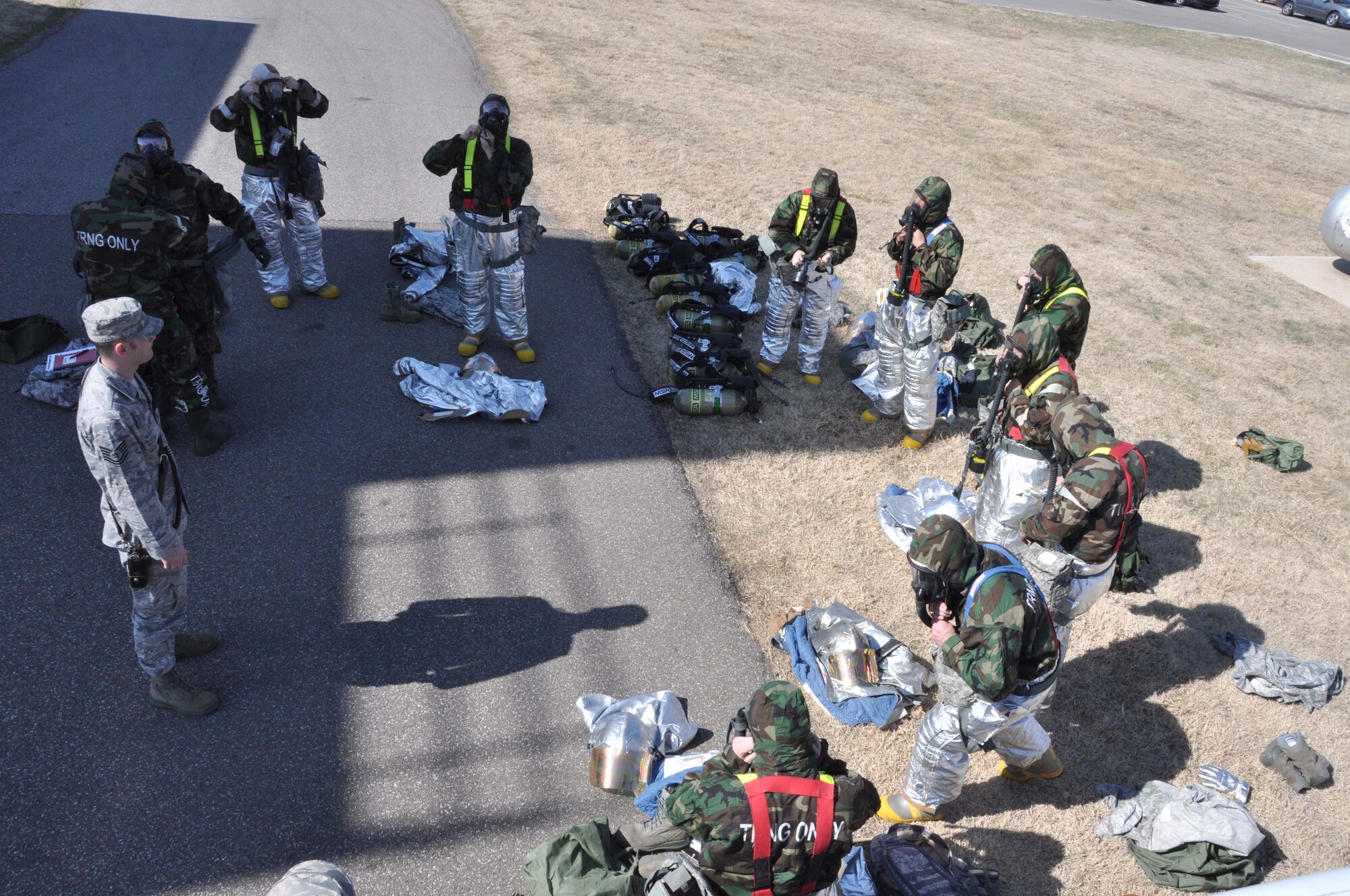 Reserve Tech. Sgt. Scott Lair instructs members of the 507th Civil Engineer Squadron on the Joint Firefighter's Integrated Response Ensemble during the Unit Training Assembly here 28 Feb. (U.S. Air Force Photo/Maj. Jon Quinlan)