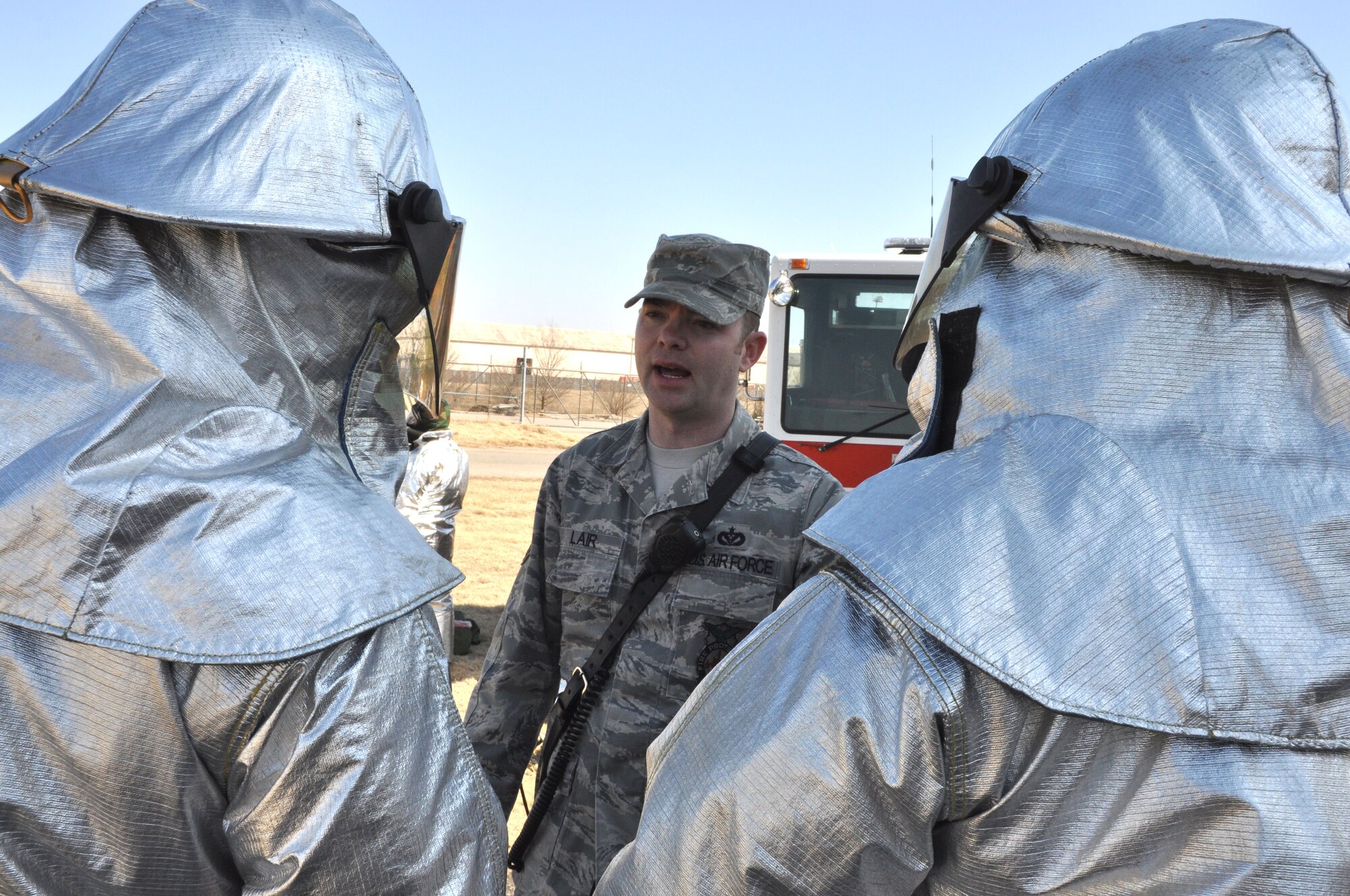 Tech. Sgt. Scott Lair provides instruction to members of the 507th Civil Engineer Squadron on the Joint Firefighter's Integrated Response Ensemble here during the March Unit Training Assembly. (U.S. Air Force Photo/Maj. Jon Quinlan)