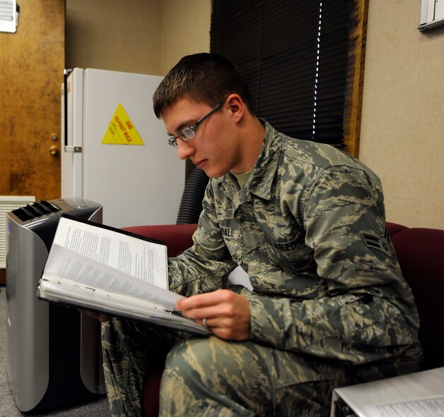 U.S. Air Force Senior Airman Jonathan Crandall, 7th Logistics Readiness Squadron, studies for his bus operator certification Feb. 25, 2014, at Dyess Air Force Base, Texas. LRS Airmen must maintain proficiency in many different types of vehicle qualifications, such as buses, forklifts, and tractor trailers. (U.S. Air Force photo by Airman 1st Class Alexander Guerrero/Released)