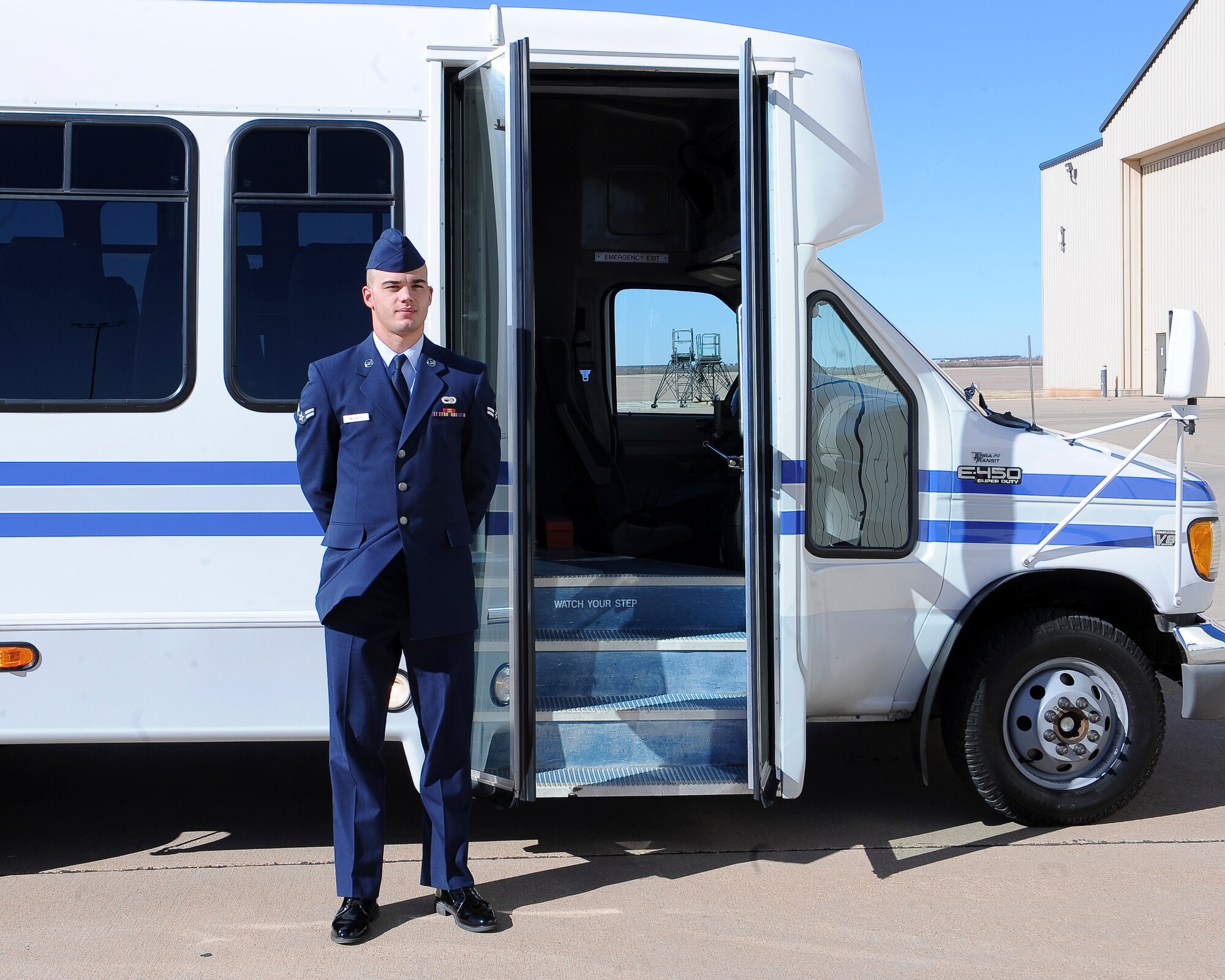 U.S. Air Force Airman 1st Class Robin Medders, 7th Logistics Readiness Squadron, waits outside of his vehicle for distinguished visitors Feb. 14, 2014, at Dyess Air Force Base, Texas. One of the most important duties LRS has is driving distinguished visitors around base. A large amount of time and effort is put towards the preparation of the visit to make sure everything goes accordingly. (U.S. Air Force photo by Airman 1st Class Kedesha Pennant/Released)