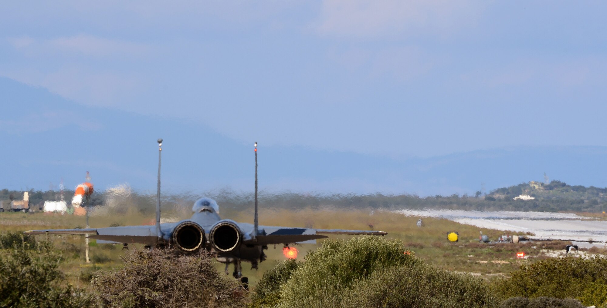 An F-15E Strike Eagle awaits clearance for takeoff from the air traffic control tower at Souda Air Base, Greece, while participating in joint, war-fighting training with the Hellenic air force, Feb. 27, 2014. More than 250 Airmen deployed to Crete to work with NATO partners and build upon a strong, military relationship. (U.S. Air Force photo by Staff Sgt. Thomas Trower/Released)