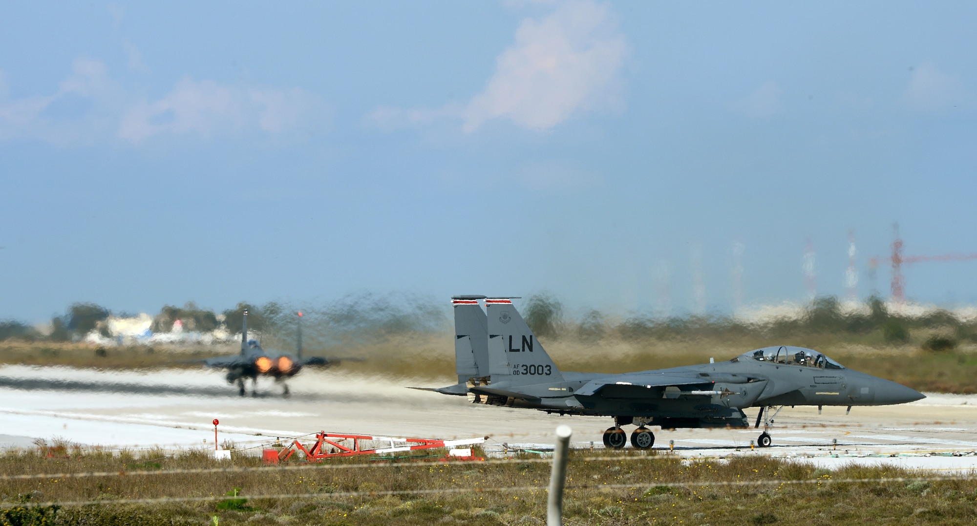 Two F-15E Strike Eagles taxi on the flightline at Souda Air Base, Greece, while participating in joint war-fighting training with the Hellenic air force, Feb. 27, 2014. More than 250 Airmen deployed to Crete to work with NATO partners and build upon a strong military relationship. (U.S. Air Force photo by Staff Sgt. Thomas Trower/Released)