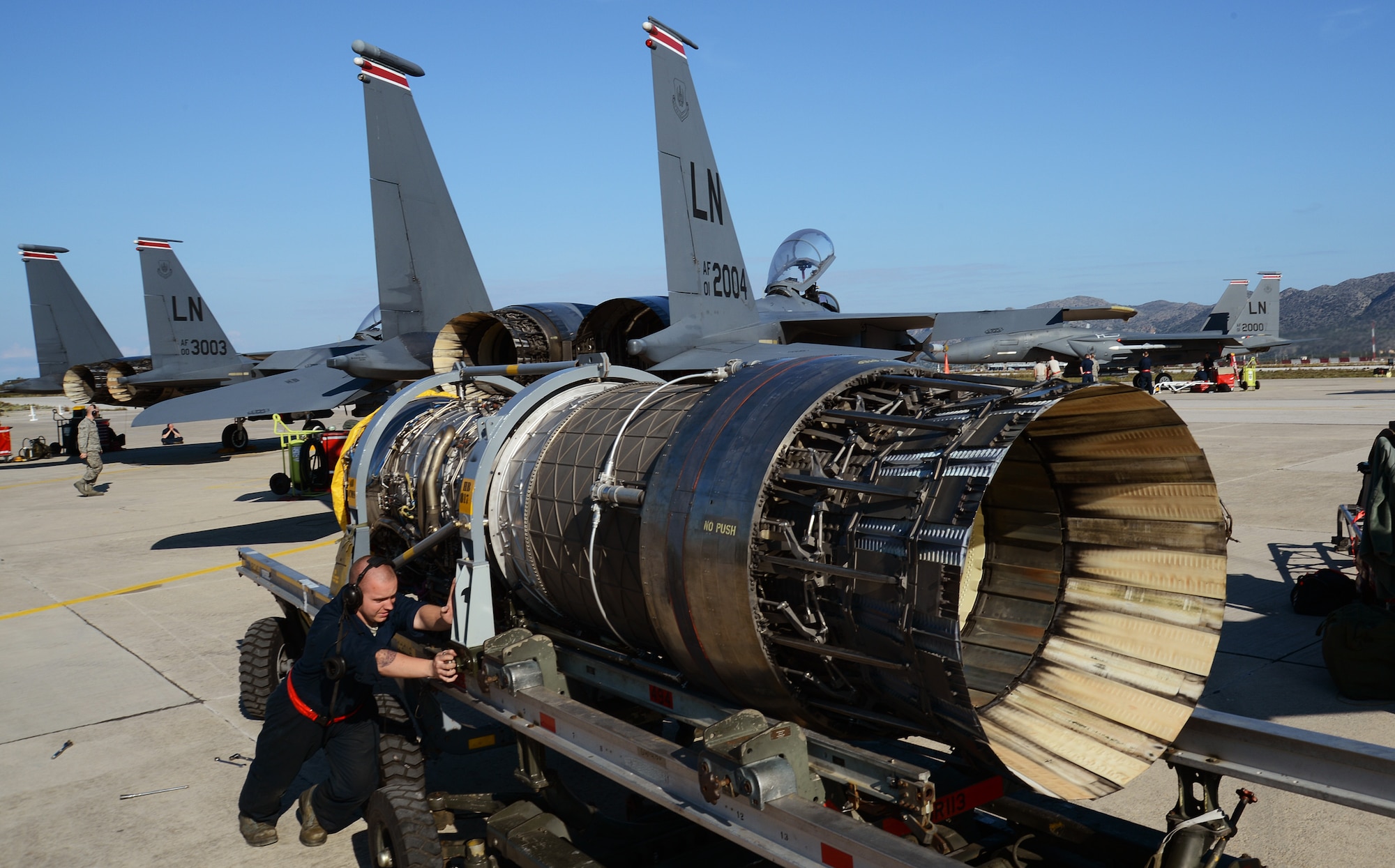 Senior Airman Christopher Strader, 494th Expeditionary Fighter Squadron maintainer, prepares an engine for replacement into an F-15E Strike Eagle at Souda Air Base, Greece, during a flying training deployment with the Hellenic air force, Feb. 27, 2014. Military relations between the U.S. and Greece date back to the early 19th century, when Greece was fighting for independence, as the two nations found commonality under their values of freedom and democracy. (U.S. Air Force photo by Staff Sgt. Thomas Trower/Released)