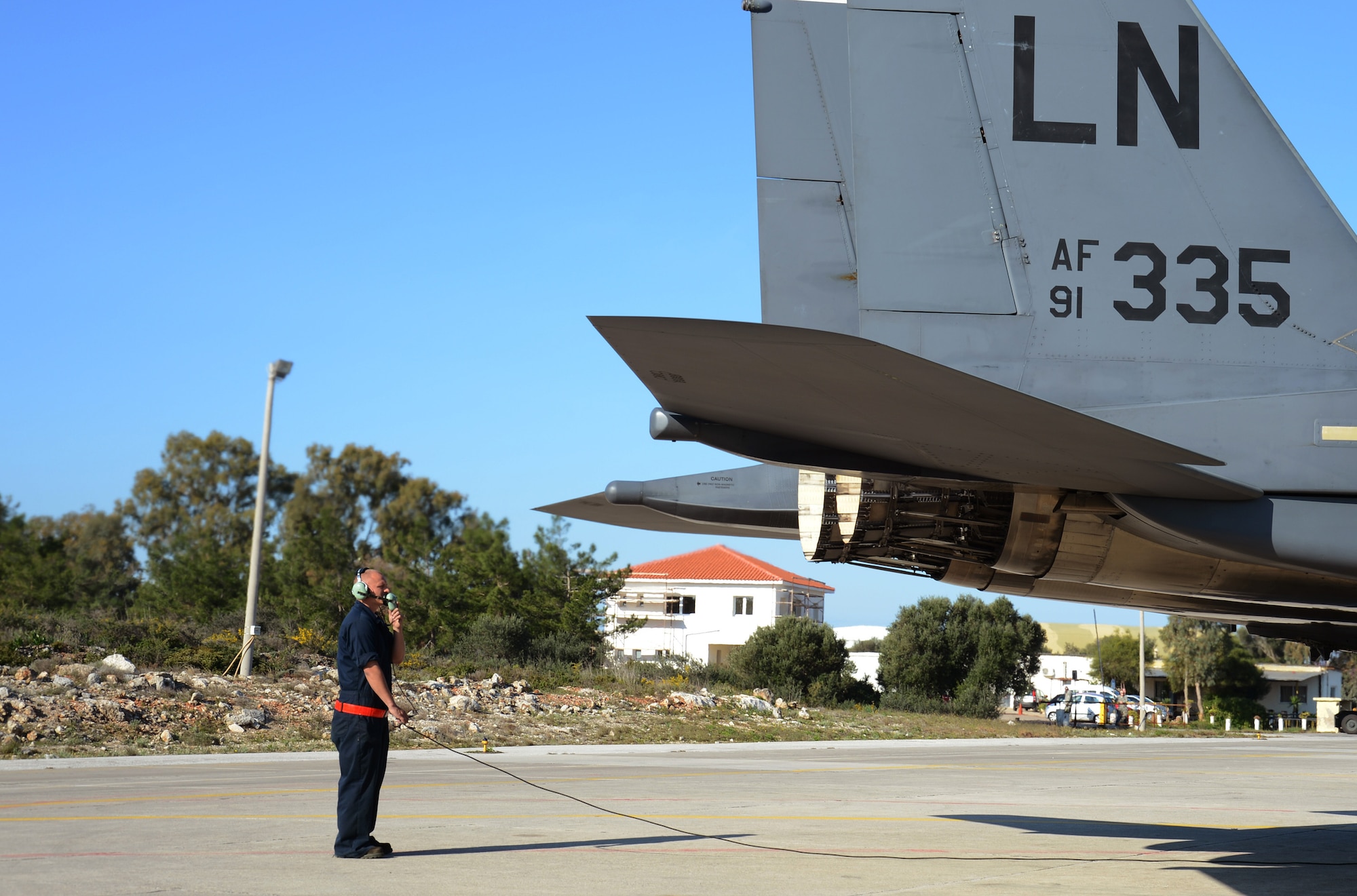Airman 1st Class James Hurt, 494th Expeditionary Fighter Squadron crew chief, conducts a pre-flight check on an F-15E Strike Eagle at Souda Air Base, Greece, during a flying training deployment with the Hellenic air force, Feb. 27, 2014. The mission exercised participating units in combined, air operations and extended joint, war-fighting capability through operational training. (U.S. Air Force photo by Staff Sgt. Thomas Trower/Released)