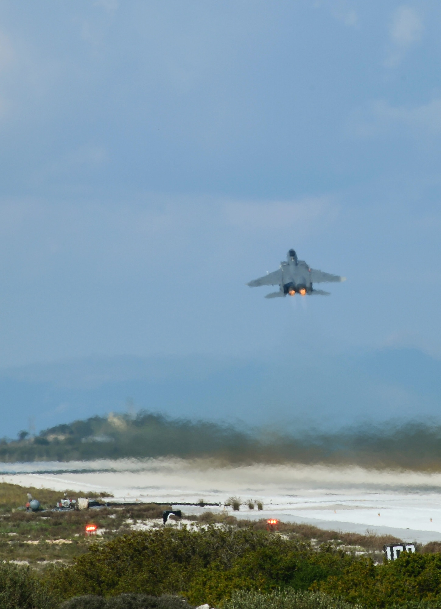 An F-15E Strike Eagle of the 494th Expeditionary Fighter Squadron conducts a vertical takeoff from Souda Air Base, Greece, during a flying training deployment with the Hellenic air force, Feb. 27, 2014. The mission exercised participating units in combined, air operations and extended joint, war-fighting capability through operational training. (U.S. Air Force photo by Staff Sgt. Thomas Trower/Released)