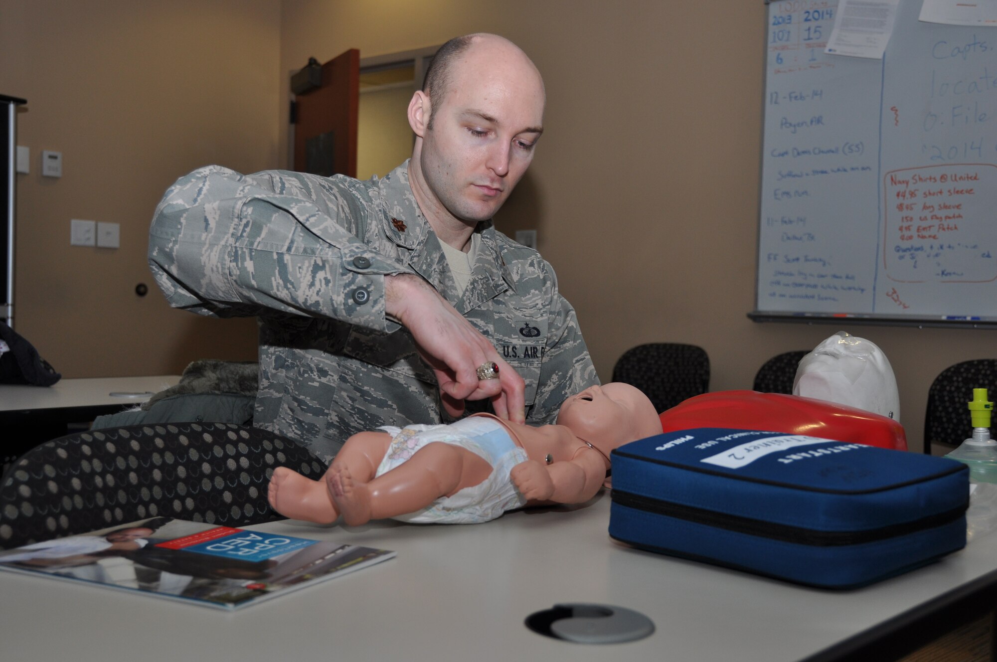 Major Joel McKowan, 914th Airlift Wing, participates in a CPR class here, February 28, 2014. The CPR course is offered once a month and covers instructions for CPR for adults, children and infants as well as the procedures for using an automated external defibrillator.  (U.S. Air Force photo by Staff Sgt. Stephanie Clark)  