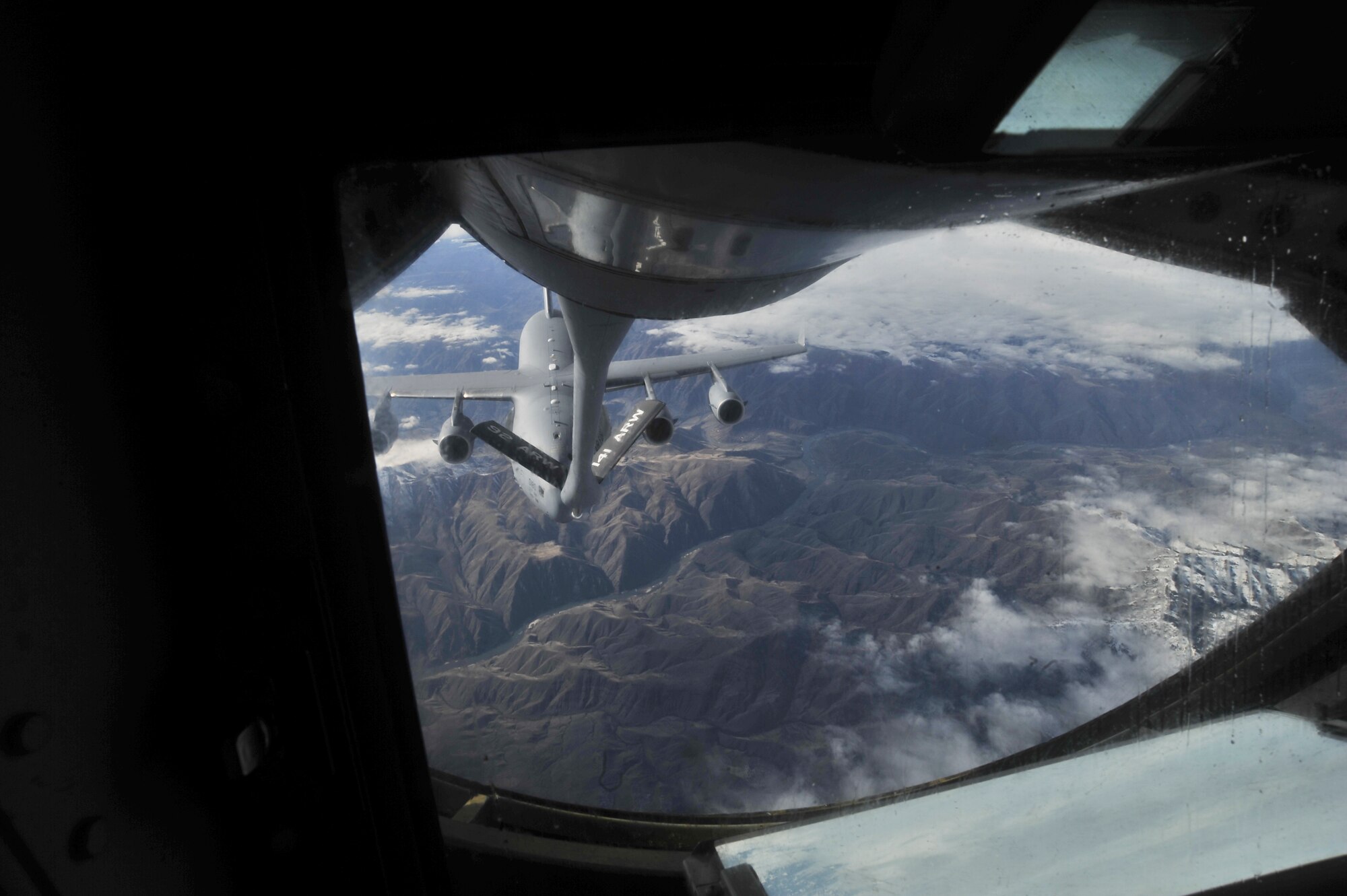 A C-17 Globemaster approaches a KC-135 for inflight refueling training over Montana Feb. 26, 2014. The KC-135 can transfer up to 200,000 pounds of fuel and can carry up to 83,000 pounds of cargo.  (U.S. Air Force Photo by Staff Sgt. Alexandre Montes)