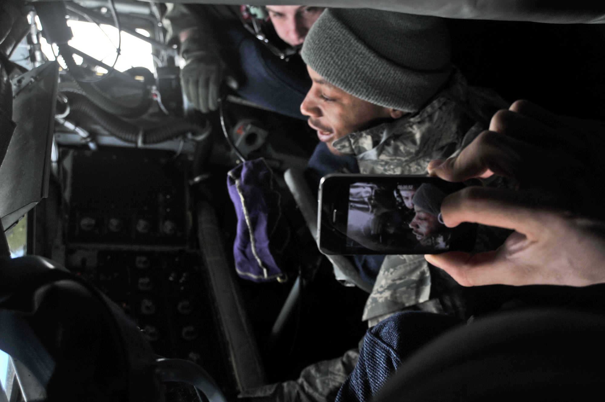 Airman First Class Jerod Cyrus, 92nd Comptroller Squadron, has someone record him operating a KC-135 Stratotanker fuel boom during an incentive refueling flight over Calif., Feb. 26, 2014.  The incentive flying programs are spread throughout the Air Force to entice good morale, a sense of purpose and recognition of a job well done. (U.S. Air Force Photo by Staff Sgt. Alexandre Montes)