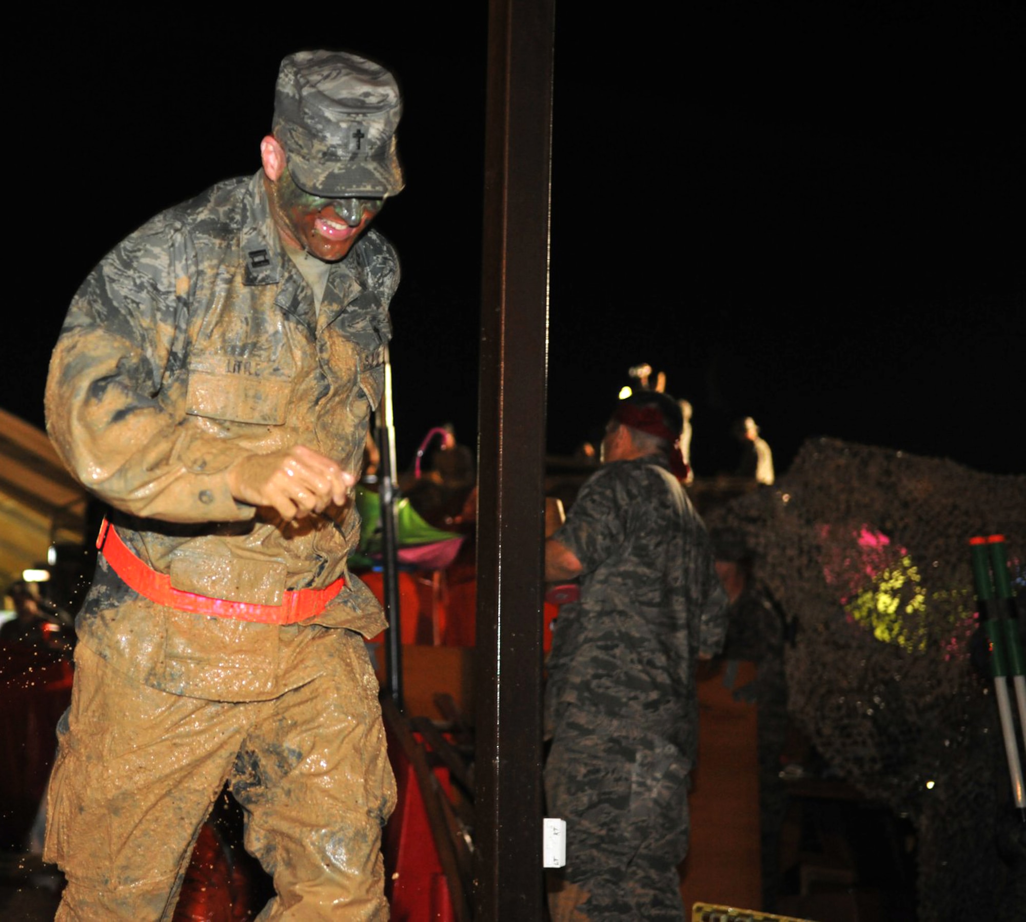 Maj. Dallas Little, 60th Air Mobility Wing chaplain, participates in a Combat Dining Out obstacle course during his most recent deployment to Southwest Asia in 2011. (courtesy photo)
