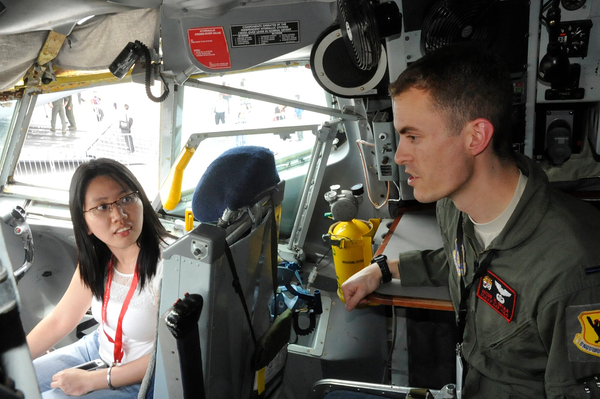 Lt. Jacob Belka, a pilot with the 909th Air Refueling Squadron from Kadena Air Base, Japan explains the KC-135 Stratotanker’s capabilities at the 2014 Singapore International Airshow, Feb. 11, 2014.  The U.S. participates in the Singapore International Airshow and other similar events to not only strengthen our international partnerships but to demonstrate the U.S. focus on regional security and stability and support to the rebalance of the Pacific. (U.S. Air Force photo/Capt. Tamara Fischer-Carter)