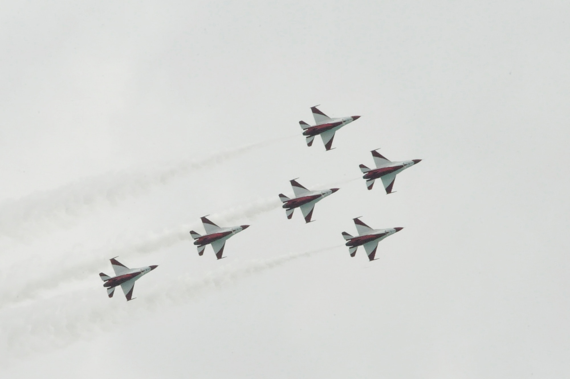 The Singapore Black Knights perform an aerial demonstration during the 2014 Singapore International Airshow, Feb 14, 2014. The event also showcased demonstrations from the Republic of Korea Black Eagles, and teams from the Air Force showcasing the C-17 Globemaster III and the F-16 Fighting Falcon. (U.S. Air Force photo/Capt. Tamara Fischer-Carter)