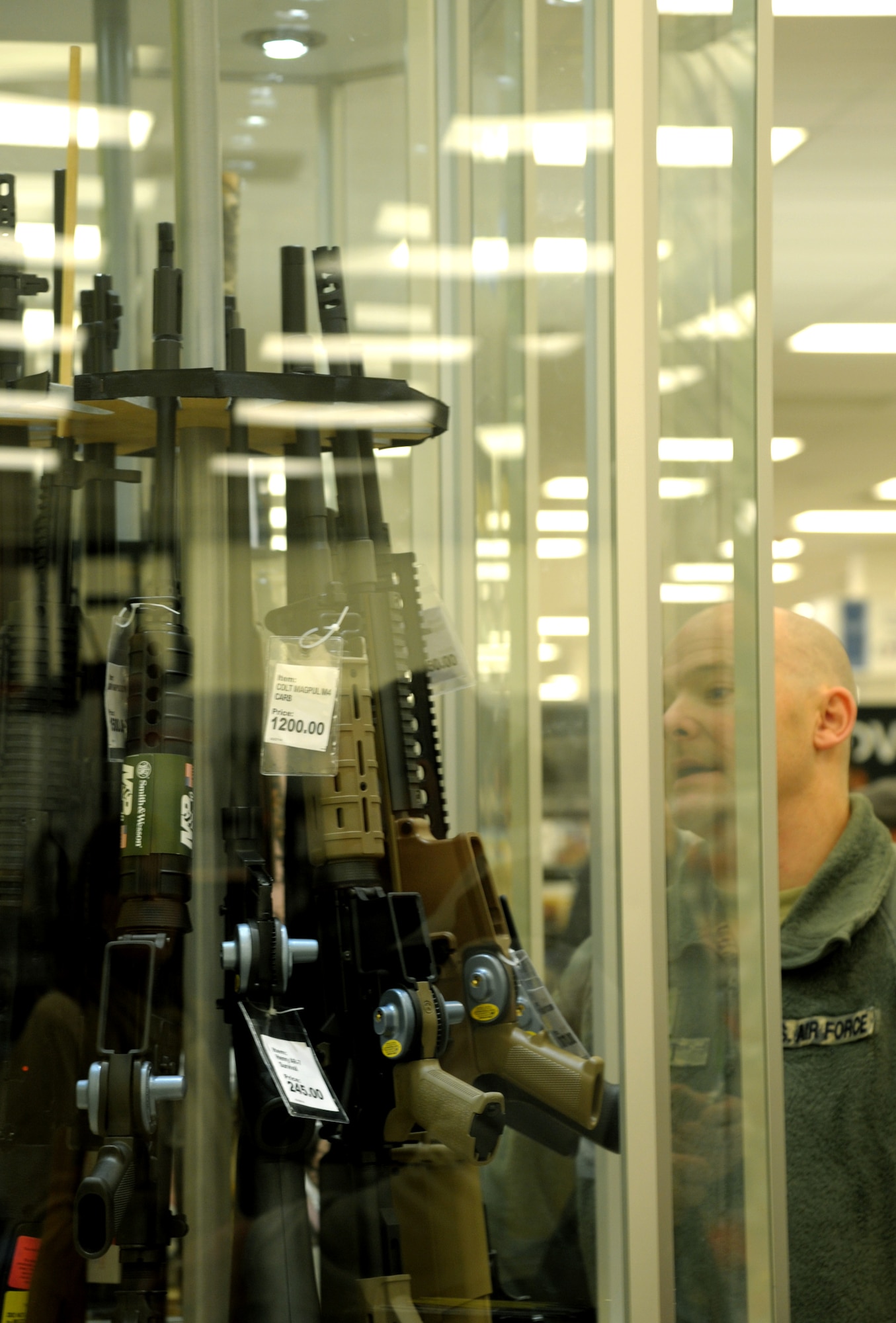 Team Scott members attend the grand opening of the Army and Air Force Exchange Services new gun counter on Scott Air Force, Il., Feb. 28, 2014. (U.S. Air Force photo/ Staff Sgt. Stephenie Wade)