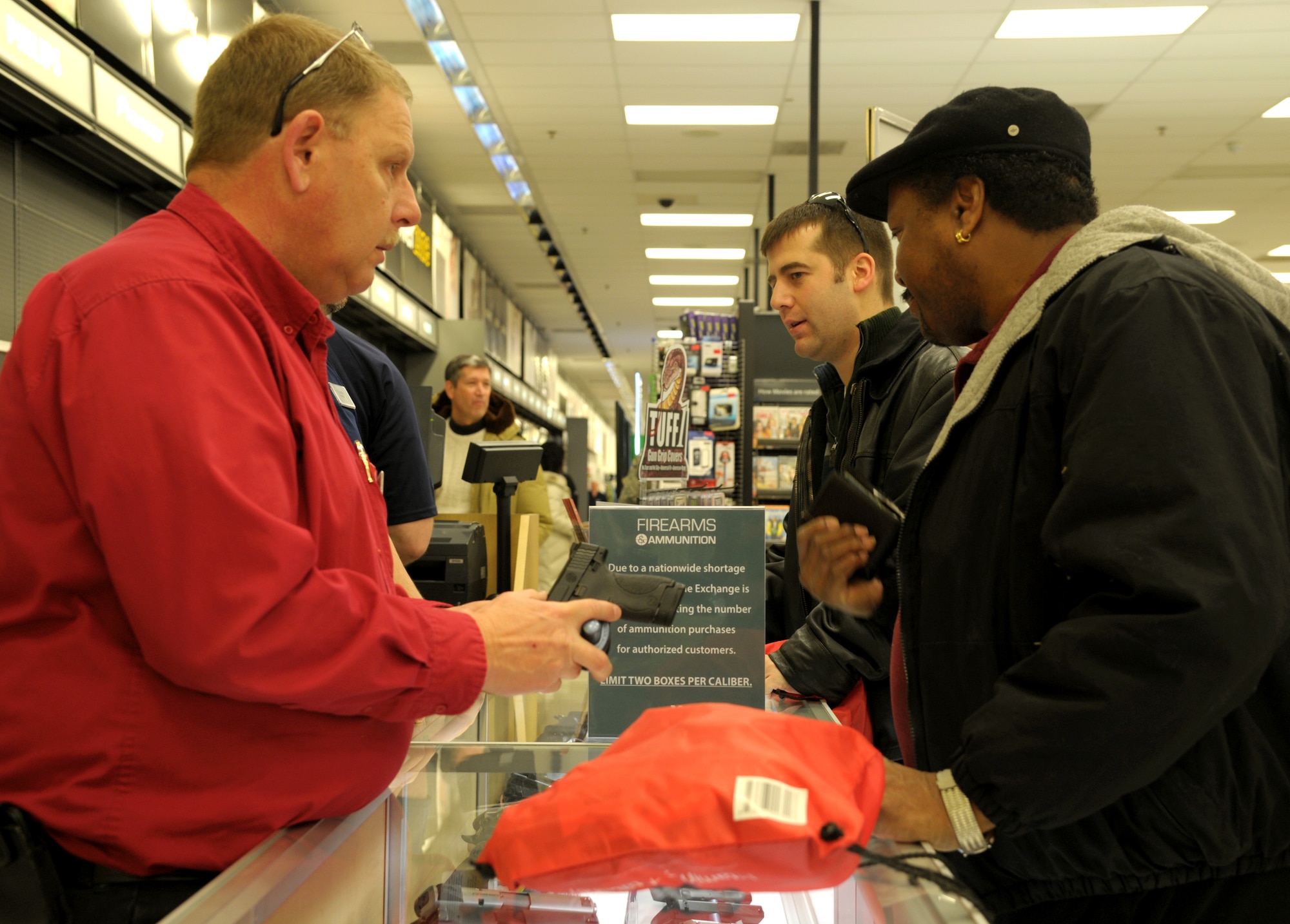 Team Scott members attend the grand opening of the Army and Air Force Exchange Services new gun counter on Scott Air Force, Il., Feb. 28, 2014. (U.S. Air Force photo/ Staff Sgt. Stephenie Wade)