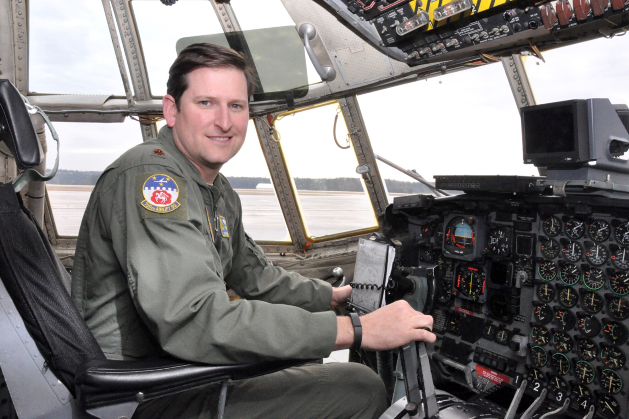 Maj. Charlie Pickett, 700th Airlift Squadron pilot, is a mission commander for C-130 formation airdrops. His secondary job is a flight commander, to rate, manage and help the progression of junior officers and pilots within the 700th AS. (U.S. Air Force photo/Staff Sgt. Karla Lehman)
