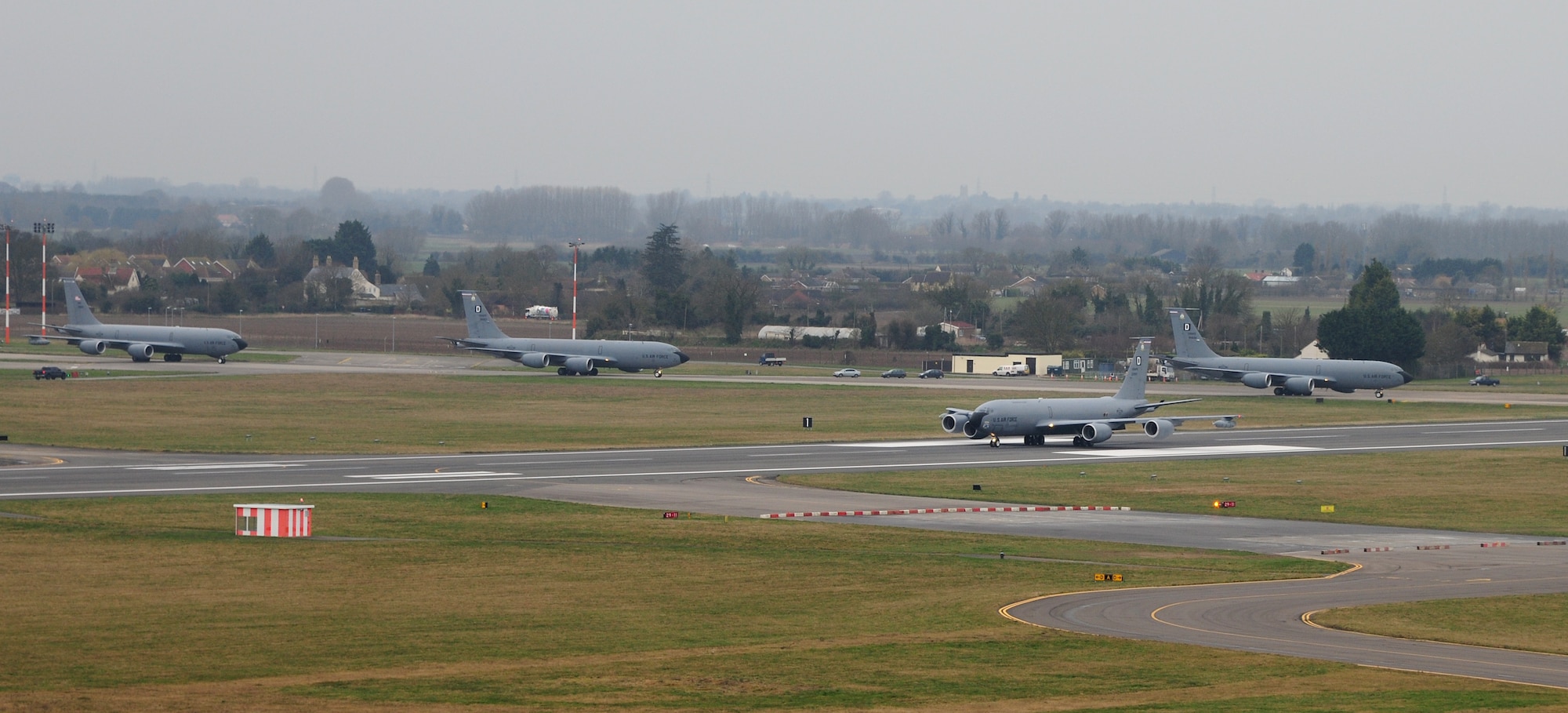 Four KC-135 Stratotankers assigned to the 100th Air Refueling Wing prepare for takeoff Feb. 28, 2014, at RAF Mildenhall, England. The 100th ARW has offloaded more than 15.5 million pounds of fuel since the start of fiscal year 2014. Team Mildenhall has the only air refueling wing in the United States Air Forces in Europe area of responsibility. (U.S. Air Force photo by Staff Sgt. Rachel Waller/Released)  