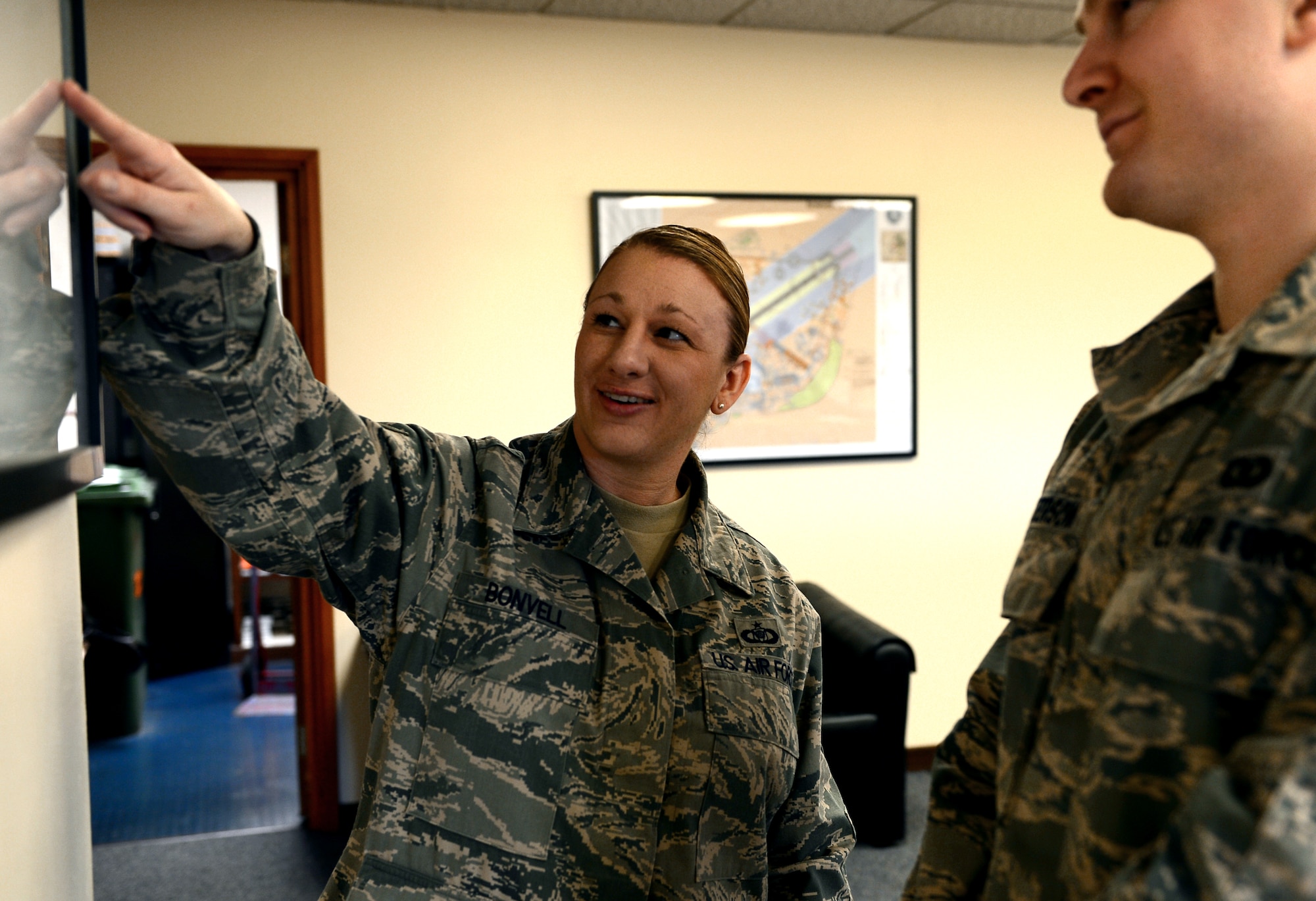 Tech. Sgt. April Bonvell, 48th Operations Support Squadron deputy airfield manager, reviews flight line driving with an Airman at Royal Air Force Lakenheath, England, Feb. 28, 2014. Bonvell was nominated for a Liberty Spotlight because she displays the core value of ‘Excellence in All We Do.’ (U.S. Air Force photo by Airman 1st Class Dawn M. Weber/Released)  