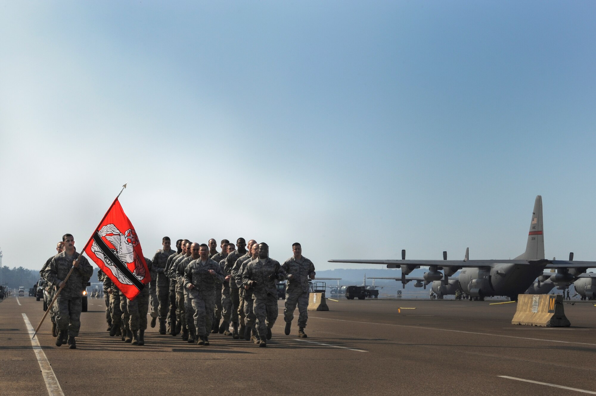 The 19th Logistics Readiness Squadron aerial porters run a 3K in remembrance of fallen aerial porters Feb. 21, 2014, at Little Rock Air Force Base, Ark. The formation run began with an invocation from a chaplain, the reading of the names of fallen aerial porters, and a moment of silence. (U.S. Air Force photo by Airman 1st Class Harry Brexel)