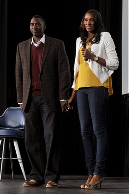 Lisa Leslie (right) and Michael Lockwood hold hands while speaking during the 21st annual National Character and Leadership Symposium Feb. 27. Both Leslie, a former women's basketball player and gold-medal Olympic athlete, and Lockwood, '89 Academy graduate and pilot, spoke about maintaining a balance between caraeer and family during their presentation. (U.S. Air Force Photo/Liz Copan)