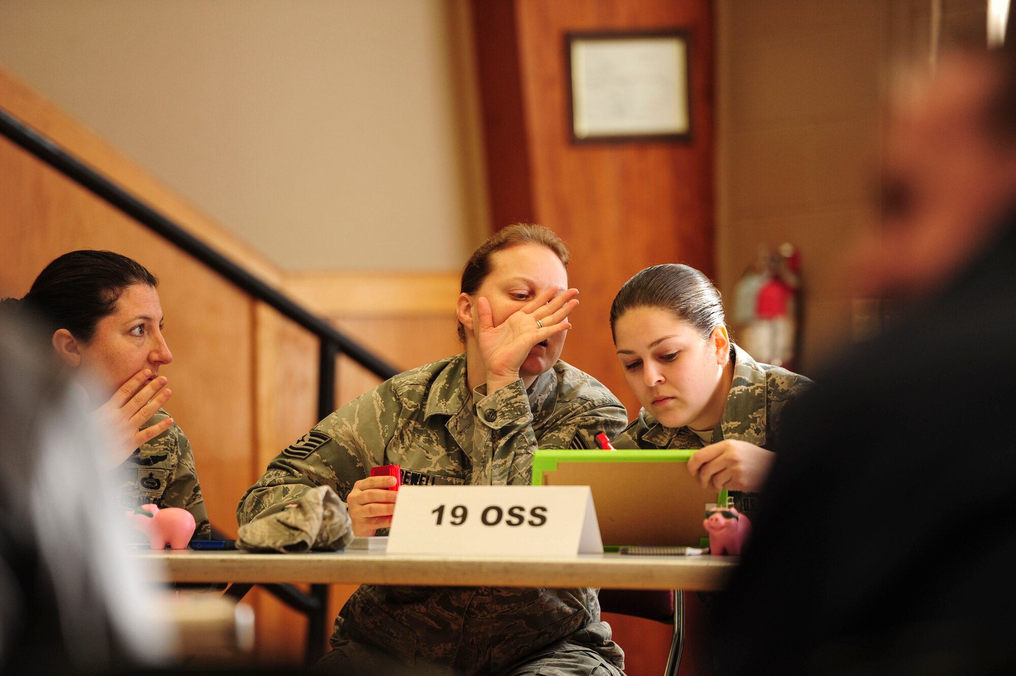 The 19th Operation Support Squadron’s Saves Week team discuss an answer Feb. 25, 2014, at Little Rock Air Force Base, Ark. Squadrons competed in the 2014 Team Little Rock Financial Literacy Single Elimination Tournament. (U.S. Air Force photo by Senior Airman Kaylee Clark)