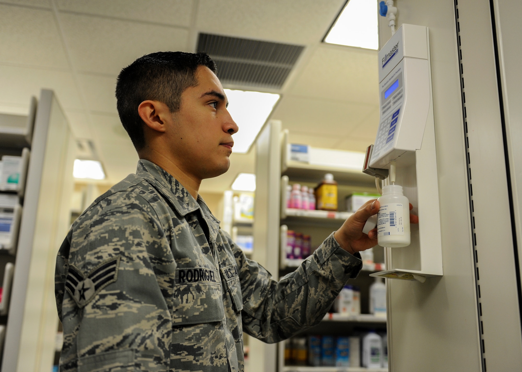 Senior Airman Armando Rodriguez, a 19th Medical Group pharmacy technician, fills a prescription by adding water to a powdered medication Feb. 24, 2014, at Little Rock Air Force Base, Ark. Prescription medications come in many varieties such as powder and must be prepared before giving it to the customer. (U.S. Air Force photo by Staff Sgt. Jessica Condit)