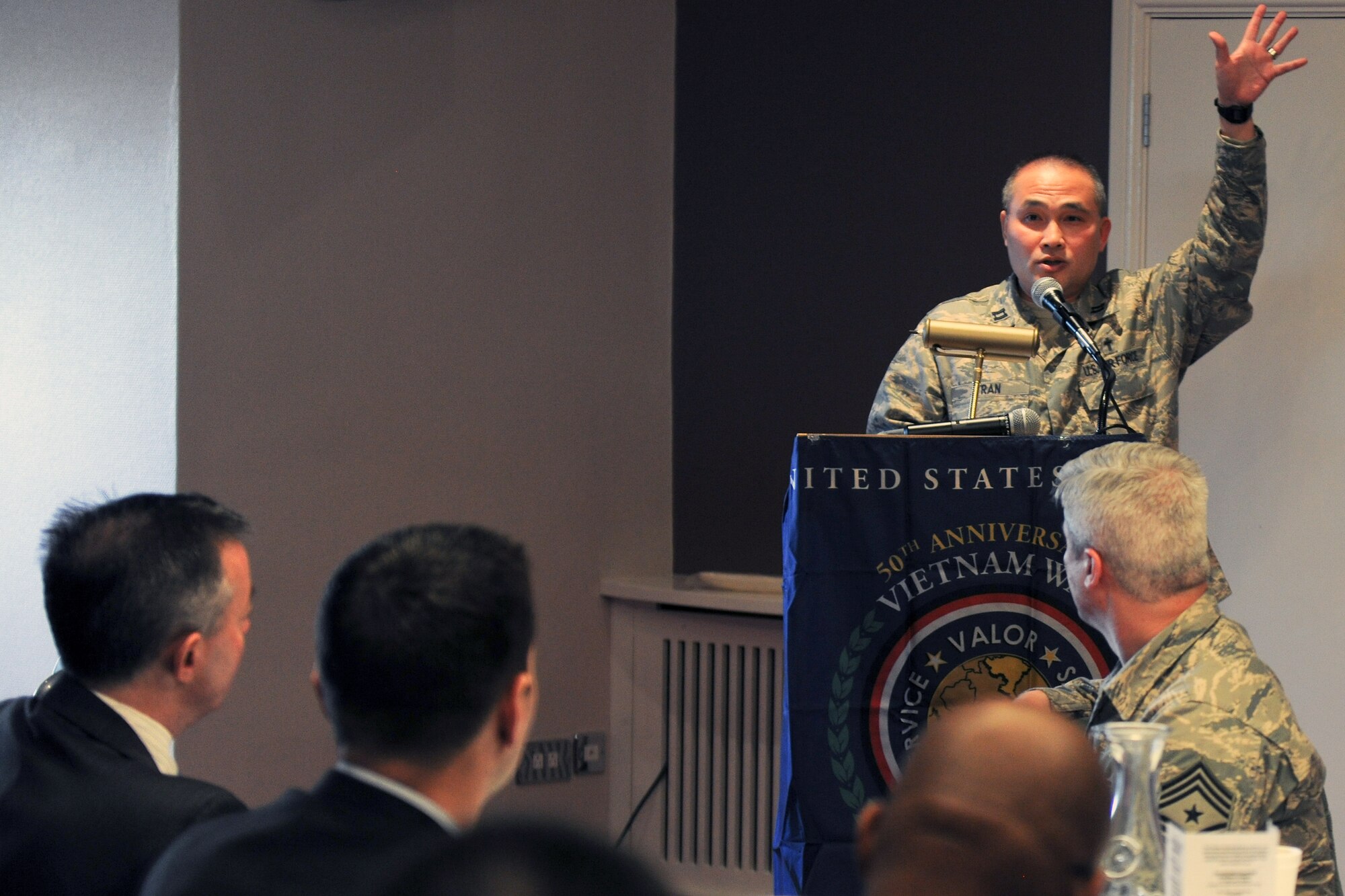 U.S. Air Force Chaplain (Capt.) Joseph Tran, 422nd Air Base Group deputy chaplain, speaks during the National Prayer Breakfast at RAF Croughton Feb. 13. Tran, who was born in Saigon during the Tet Offensive, and his fellow guest speaker, retired U.S. Army Chaplain (Col.) William Carter, shared their experiences of the military and civilian sides of the Vietnam War. (U.S. Air Force photo by Staff Sgt. Brian Stives)