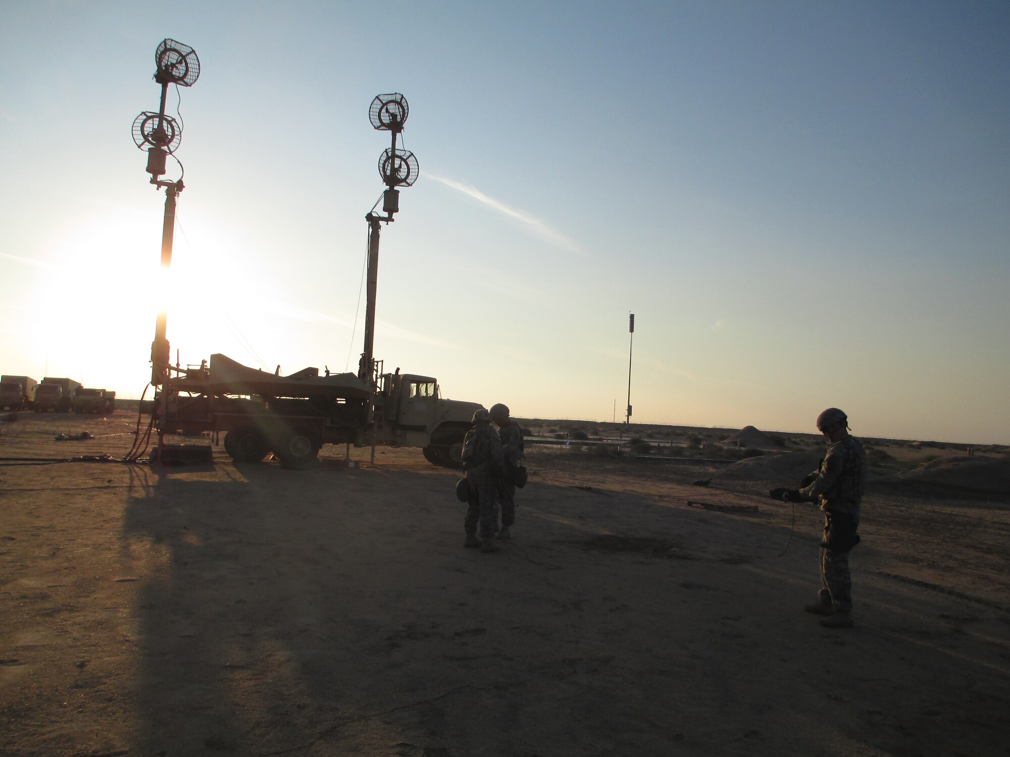 Antennae Mast Group (AMG) March Order and Emplacement crew Sgt. Sheb Angulo, Spc. Randy Bergman, and Spc. David Burleson, Bravo Btry., 1st Bn., 44th Air Defense Artillery Regt., roll up guide wires for the AMG in preparation for movement. Bravo Btry. recently completed a mobility exercise from 19-21 January 2014. The unit validated its ability to tactically move from one area of operation to another. (Photo courtesy 1-44 ADA Bn.).