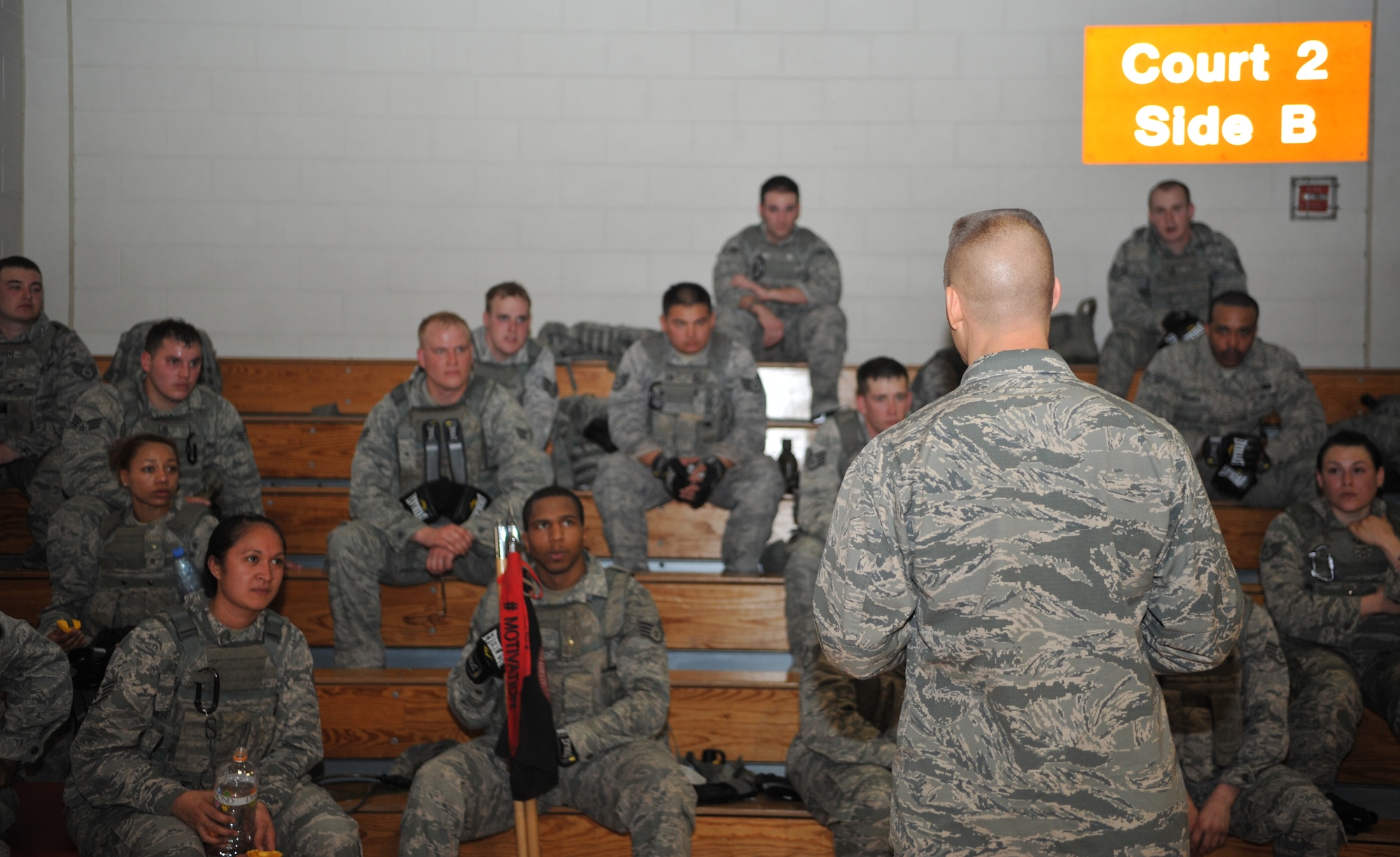 Col. Brook Leonard, 51st Fighter Wing commander, addresses defenders from the 51st Security Forces Squadron after a House of Pain exercise in the fitness center at Osan Air Base, Republic of Korea, Feb. 27, 2104. Leonard commended the Airmen’s effort during the event and emphasized the importance of joint training with their ROK counterparts. (U.S. Air Force photo/Airman 1st Class Ashley J. Thum) 