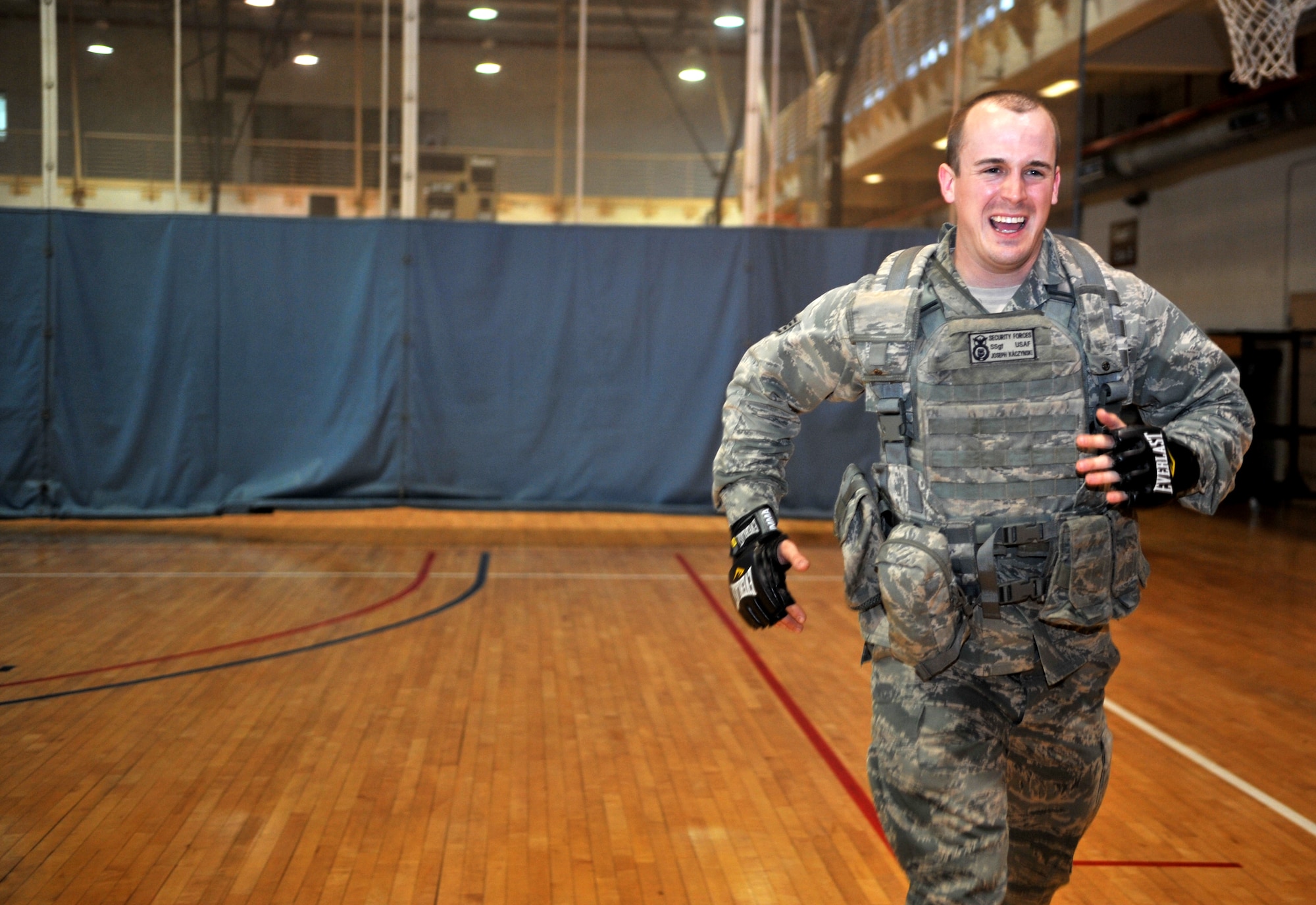 Staff Sgt. Joseph Kaczynski, a member of the 51st Security Forces Squadron, runs sprints during a House of Pain training event in the fitness center at Osan Air Base, Republic of Korea, Feb. 27, 2014. House of Pain mimics training used by the U.S. Marine Corps and completion is mandatory for all 51st SFS personnel. (U.S. Air Force photo/Airman 1st Class Ashley J. Thum)