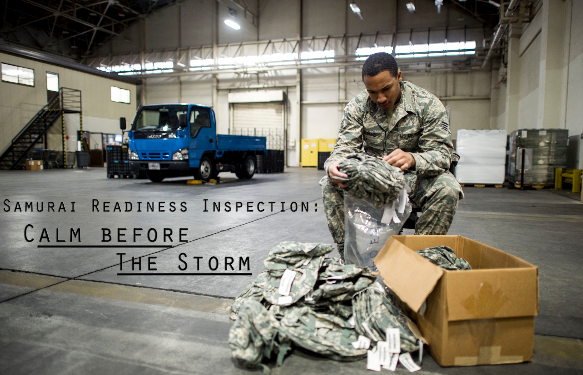 Senior Airman Ronald Sloane, 374th Logistics Readiness Squadron individual protective equipment technician, inspects helmet covers in preperation for Yokota’s upcoming Samurai Readiness Inspection at Yokota Air Base, Japan, Feb. 28, 2014. 374 LRS Airmen are responsible for all IPE used by Yokota Airmen during exercises and real-world contingencies.