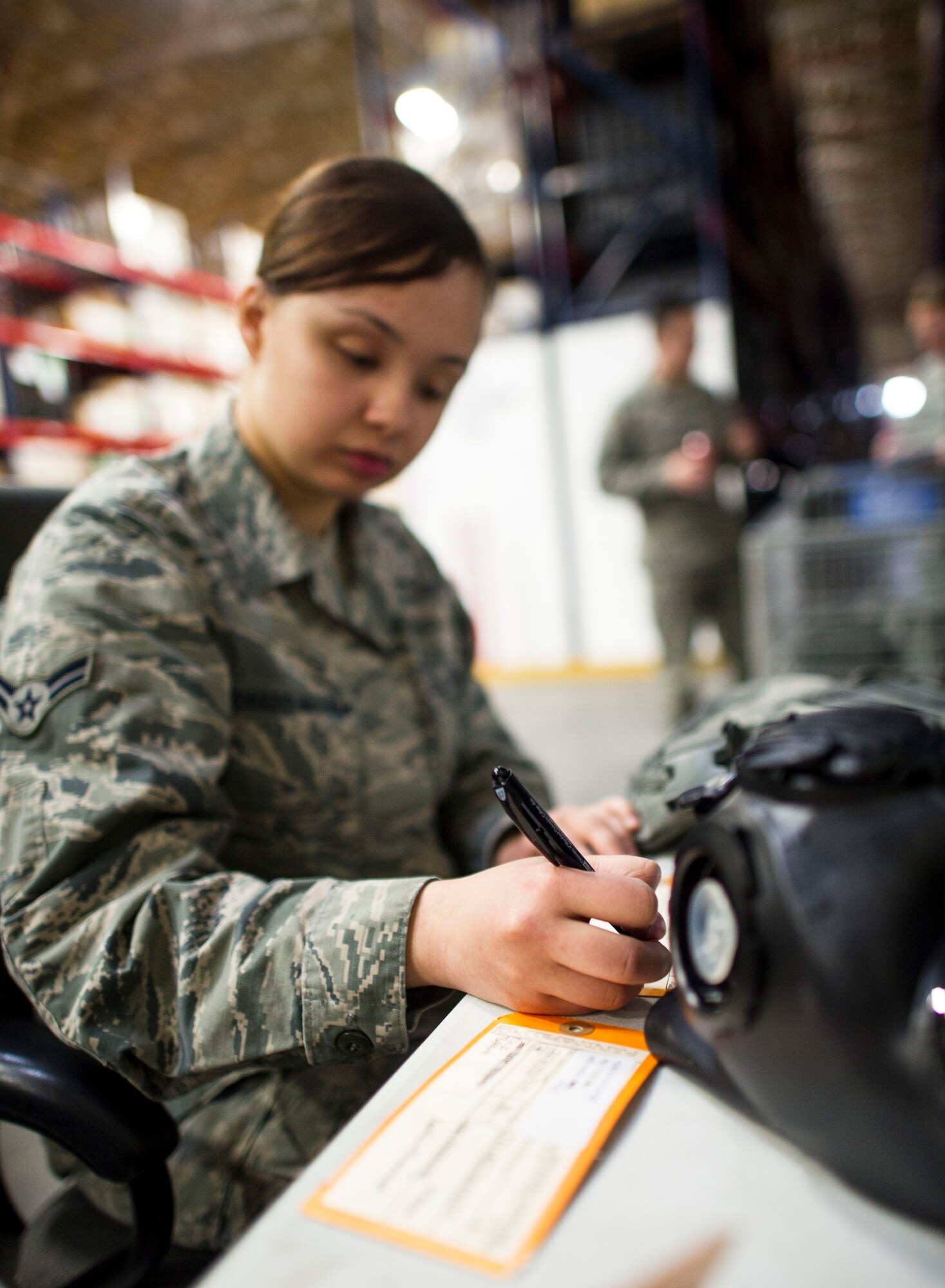 Airman 1st Class Angelika Maldonado-Matlega, 374th Logistics Readiness Suadron individual protective equipment technician, inspects gas masks at Yokota Air Base, Japan, Feb. 28, 2014. 374 LRS Airmen are responsible for all IPE used by Yokota Airmen during exercises and real-world contingencies. (U.S. Air Force photo by Staff Sgt. Stacy Moless)