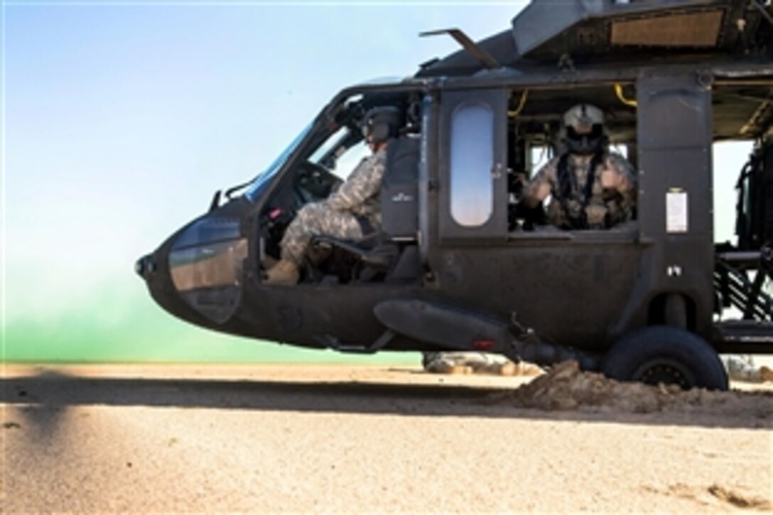 A UH-60 Black Hawk helicopter provides aviation support for an air assault mission as part of Operation Intrepid Centurion near Camp Buehring, Kuwait, Feb. 19, 2014. 