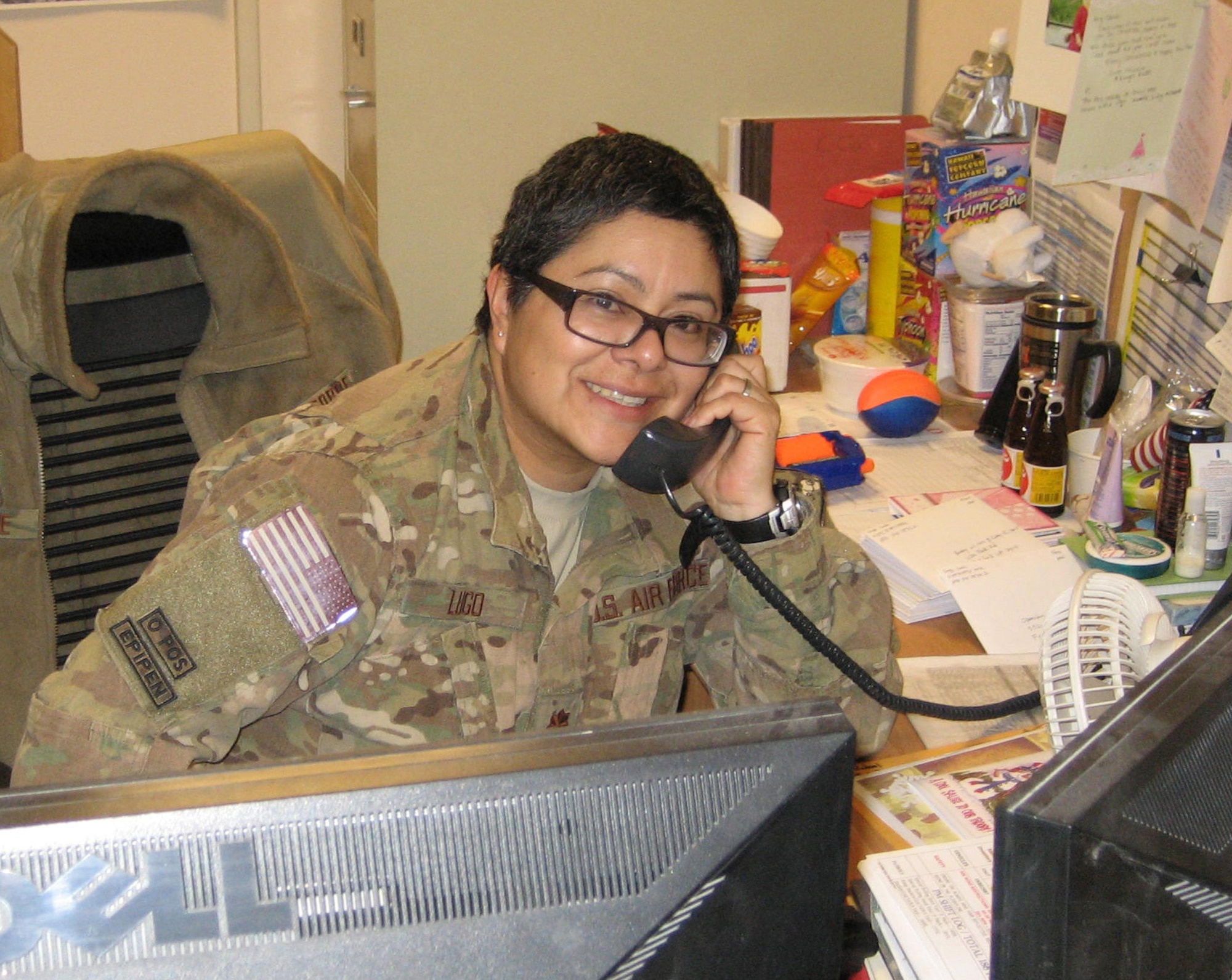 Maj. Carla Lugo receives a phone call from Secretary of the Air Force Deborah Lee James, Dec. 31, 2013 at Bagram Airfield, Afghanistan. The secretary called to wish deployed Airmen a happy new year and let them know the Air Force leadership team was thinking about them and their families. Lugo is a native of Flagstaff, Ariz. (Courtesy Photo)