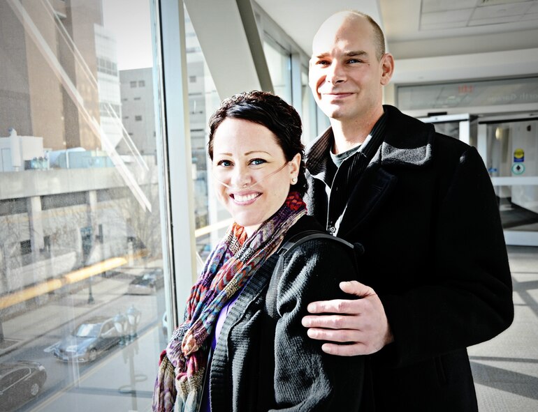 Staff Sgt. Jennifer Vaughan and her fiancé, Master Sgt. Daniel Grabski, know the hallways of the  Siteman Cancer Center in St. Louis all too well as Jennifer spent seven months there after doctors performed an innovative and life-saving procedure when her lungs failed on Christmas Day 2012.  She had been diagnosed with acute myeloid leukemia, a type of blood cancer, and doctors put her on a lung bypass machine normally used only in infants while also administering chemotherapy.  She is now in remission and hopes her story will help other patients, doctors and families in similar situations. Vaughan and Grabski are both assigned to the 375th Aerospace Medicine Squadron.  (U.S. Air Force photo/Karen Petitt) 