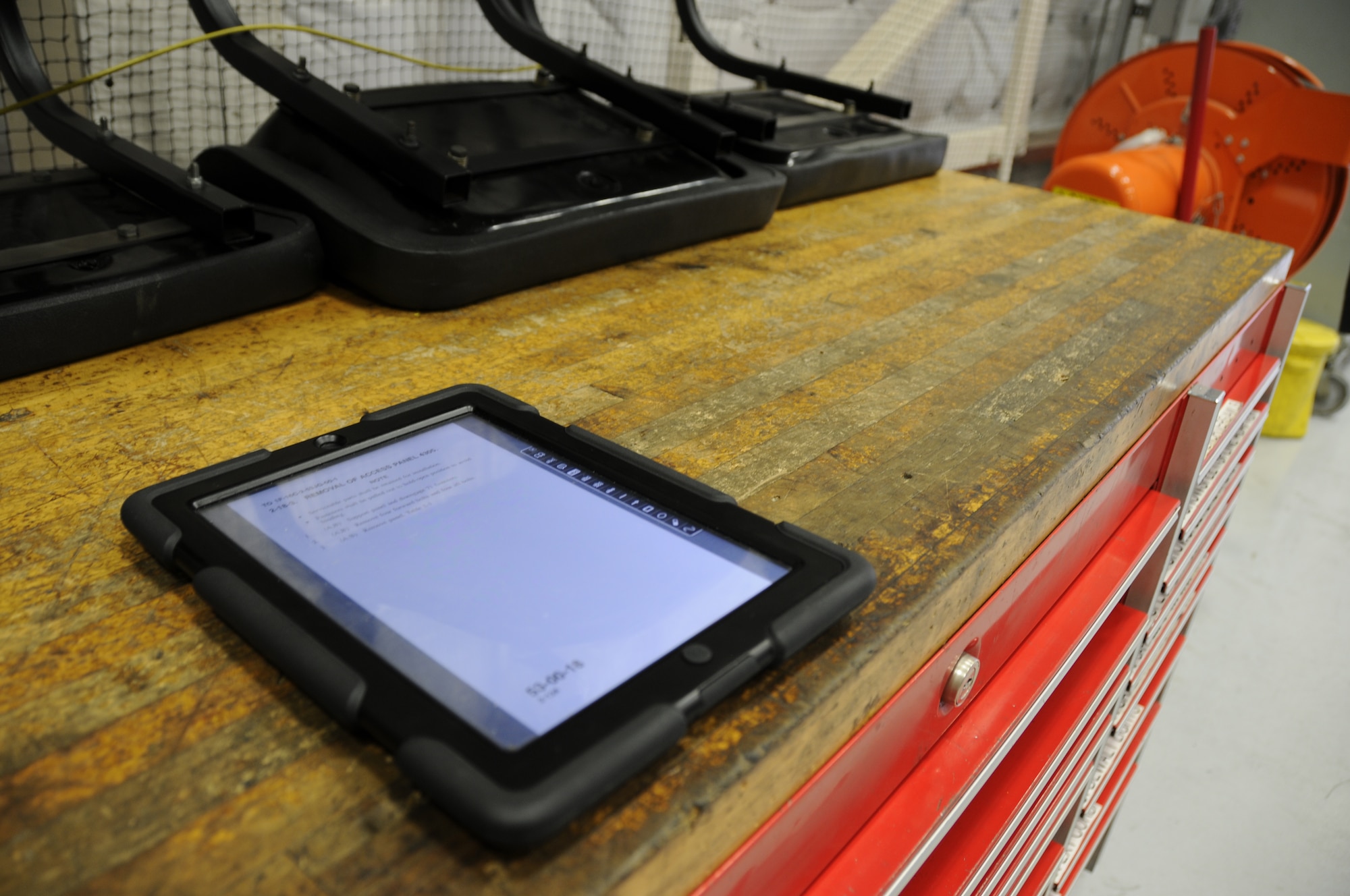 Maintainers at Homestead Air Reserve Base, Fla., now use iPads in place of paper books for their technical orders. The iPads use less space on workbenches, and are less likely to lead to foreign object debris. (U.S. Air Force Photo/ Senior Airman Nicholas Caceres)