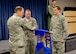 Col. Robert Hamm (left), commander of the 123rd Operations Group, and Senior Master Sgt. Colin King (center), operations group first sergeant, unfurl the new unit flag of the 123rd Operations Support Squadron as Lt. Col. Matthew Groves, 123rd OSS commander, stands by to accept the guidon during a redesignation ceremony at the Kentucky Air National Guard Base in Louisville, Ky., Nov. 24, 2013. Prior to the ceremony, the 123rd Operations Support Squadron was classified as a flight. (U.S. Air National Guard photo by Airman 1st Class Joshua Horton)
