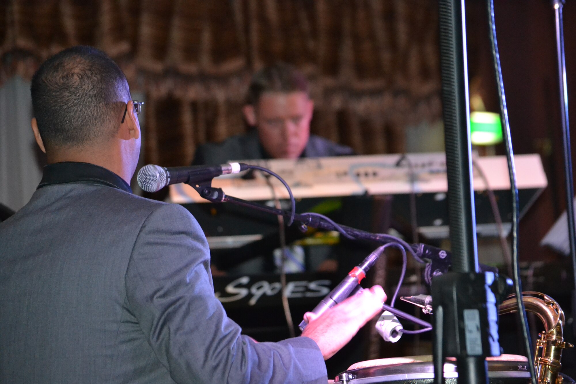 “Systems Go,” assigned to U.S. Air Forces Central Command, performs on New Year’s Eve in Southwest Asia, Dec. 31, 2013.  This AFCENT band performs a wide variety of hit songs from genres such as jazz, pop, rock and country, providing a high energy atmosphere raising joint and coalition morale.  Senior Airman Luis Rosa and Technical Sgt. Shane Spanier are members of “Systems Go,” the band deployed from Wright-Patterson Air Force Base.  Rosa, a San Juan, P.R. native plays Latin percussion while Spanier, a native of Atwood, Kan. on keyboards.  During the holidays, the AFCENT band performed 40 shows in 30 days reaching an audience of 5,700 service members throughout the Central Command area of responsibility.  (U.S. Air Force Photo by Maj. Nicole David)