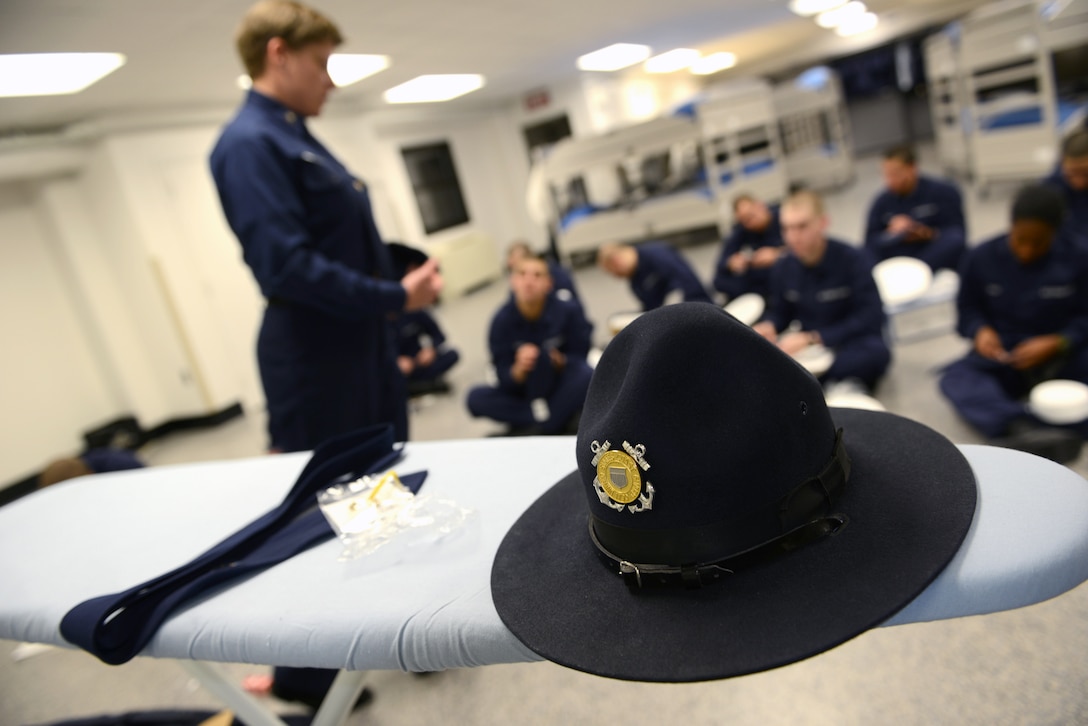 U.S. Coast Guard Petty Officer 1st Class Tanya LaFrance conducts uniform maintenance training with the recruits of Foxtrot Company 189 at Training Center Cape May, N.J., Dec. 31, 2013. LaFrance is a company commander at Training Center Cape May, N.J.