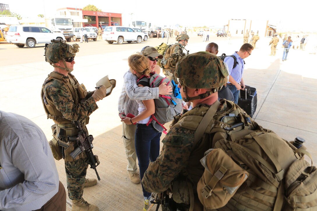 Marines and sailors with Special-Purpose Marine Air-Ground Task Force Crisis Response help U.S. citizens into a Marine Corps KC-130J Hercules airplane in Juba, South Sudan, during an evacuation of personnel from the U.S. Embassy, Jan. 3, 2014.  A squad-size element of U.S. Marines from Special-Purpose Marine Air-Ground Task Force Crisis Response successfully evacuated more than 20 personnel from the U.S. Embassy in coordination with the East Africa Response Force, and under the command and control of Combined Joint Task Force-Horn of Africa.  The Marines from Special-Purpose Marine Air-Ground Task Force Crisis Response are specifically trained for scenarios in which they provide support to a U.S. Embassy in the form of fixed-site security, Embassy reinforcement, support to non-combatant evacuation, and other missions as directed.