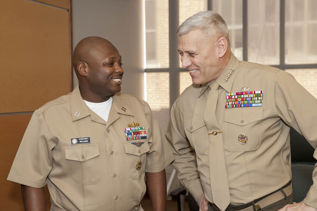 The Assistant Commandant of the Marine Corps, Gen. John M. Paxton, Jr., right, speaks with newly promoted Lt. Courtney Williams at the Washington Navy Yard in Washington, D.C., Jan. 3, 2014. (U.S. Marine Corps photo by Cpl. Tia Dufour/Released)