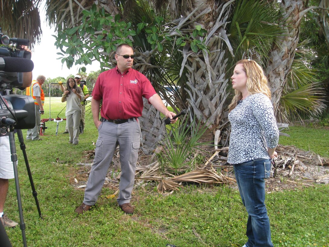 Amanda Ellison (right) of CCO covered President Obama’s visit to Jacksonville Harbor in 2013, and also took a turn in front of the cameras to talk about the district’s remedial investigation work at the Mullet Key Formerly Used Defense Site at Fort DeSoto Park near St. Petersburg, Fla.